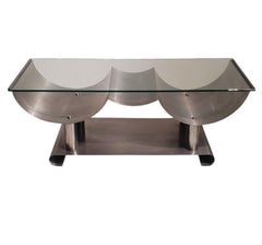 A 1970's wave design glass and steel coffee table attrib to Maria Pergay