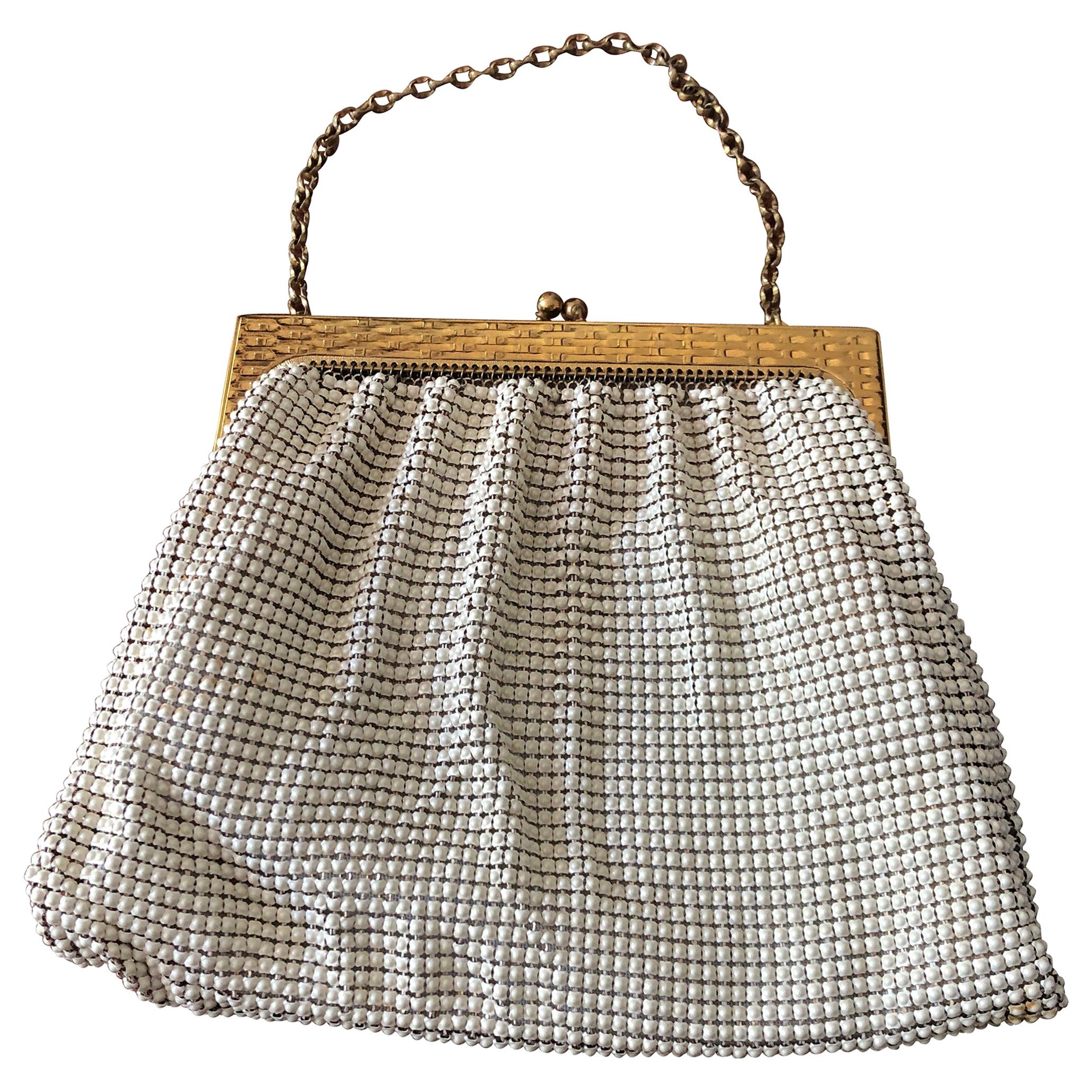 A 1960s Whiting and Davis Gold and White Mesh Hand Bag at 1stDibs