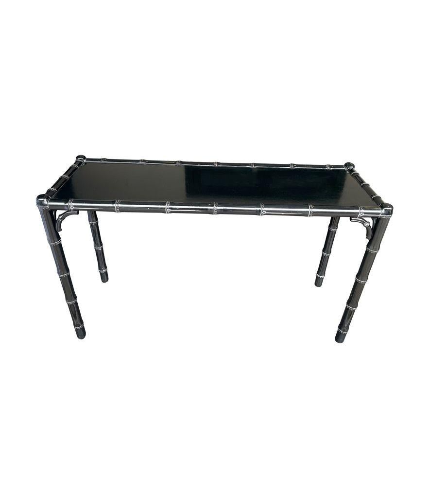 A 1970s chinoiserie black lacquered, faux bamboo ,wooden console table.