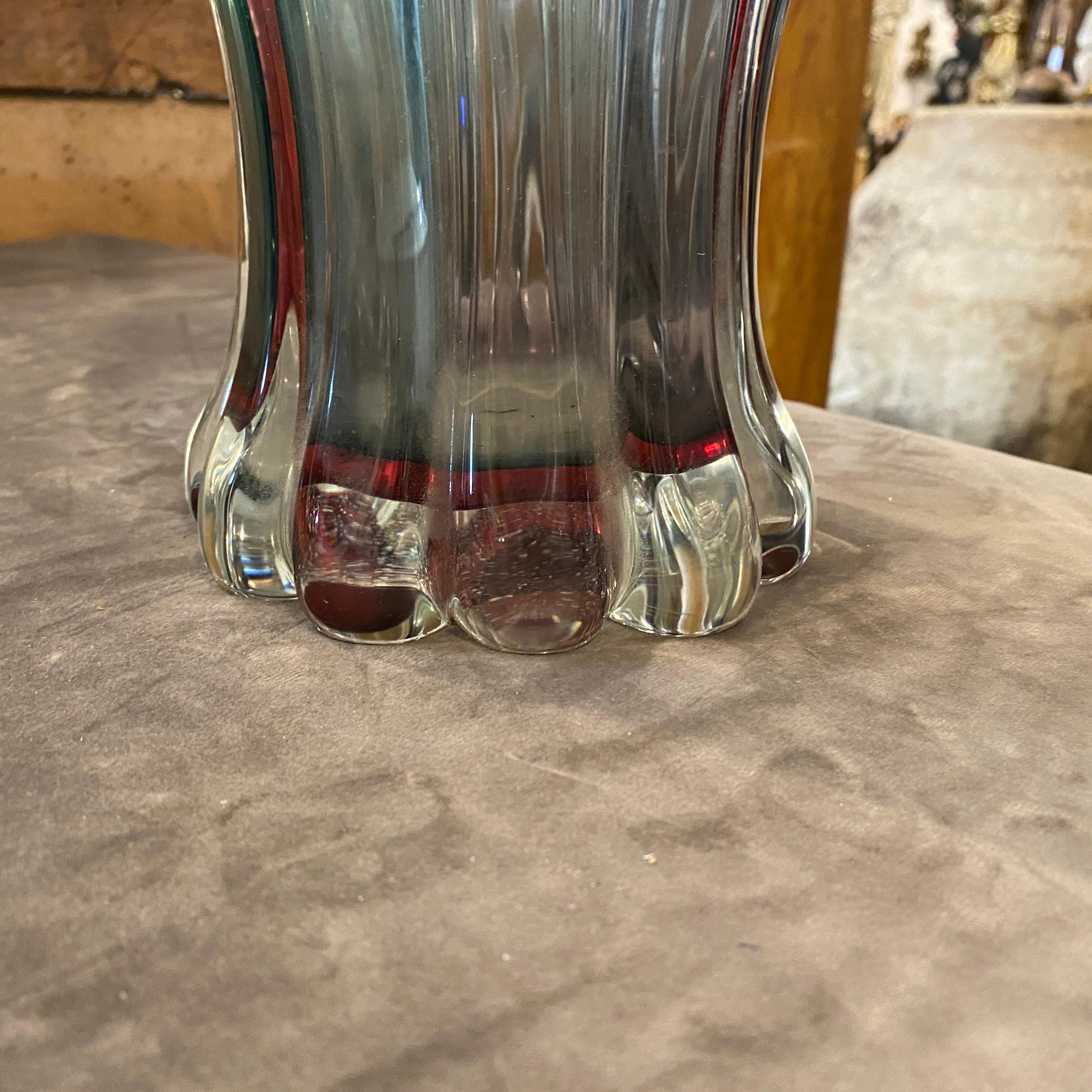It's a purple and blue murano glass vase designed and manufactured in Italy by Flavio Poli for Seguso. It's in perfect conditions. This Vase is a striking and collectible piece of Italian glass art that embodies the distinctive features of Murano