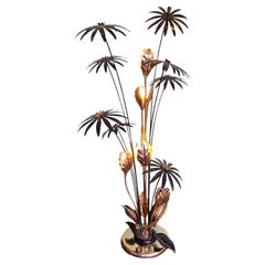 A 1970s French brass and black enamel flower floor lamp with five lights