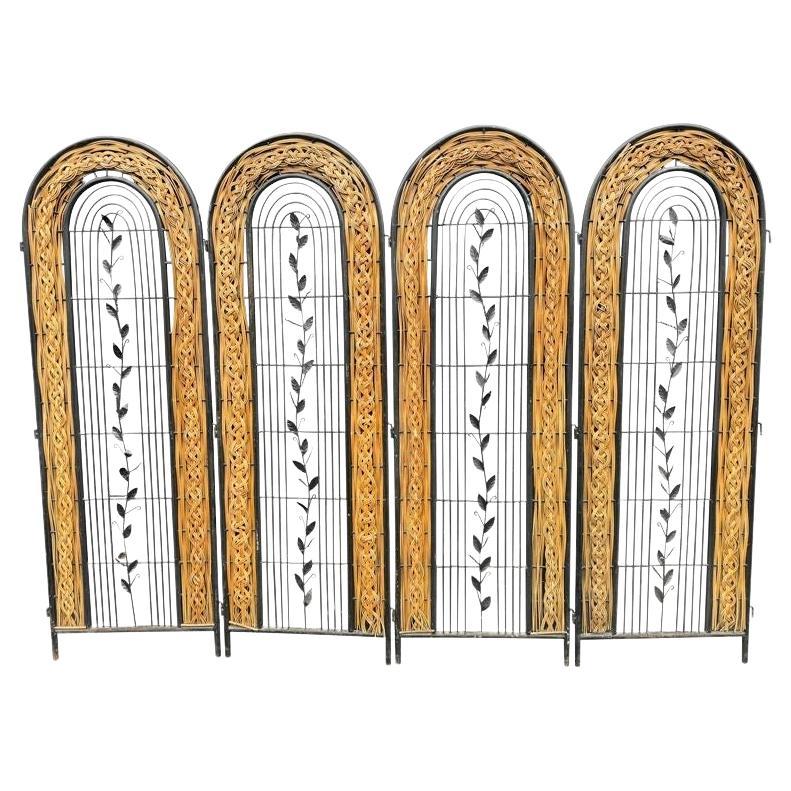 A 1970s French woven rattan and metal four panelled room divider screen