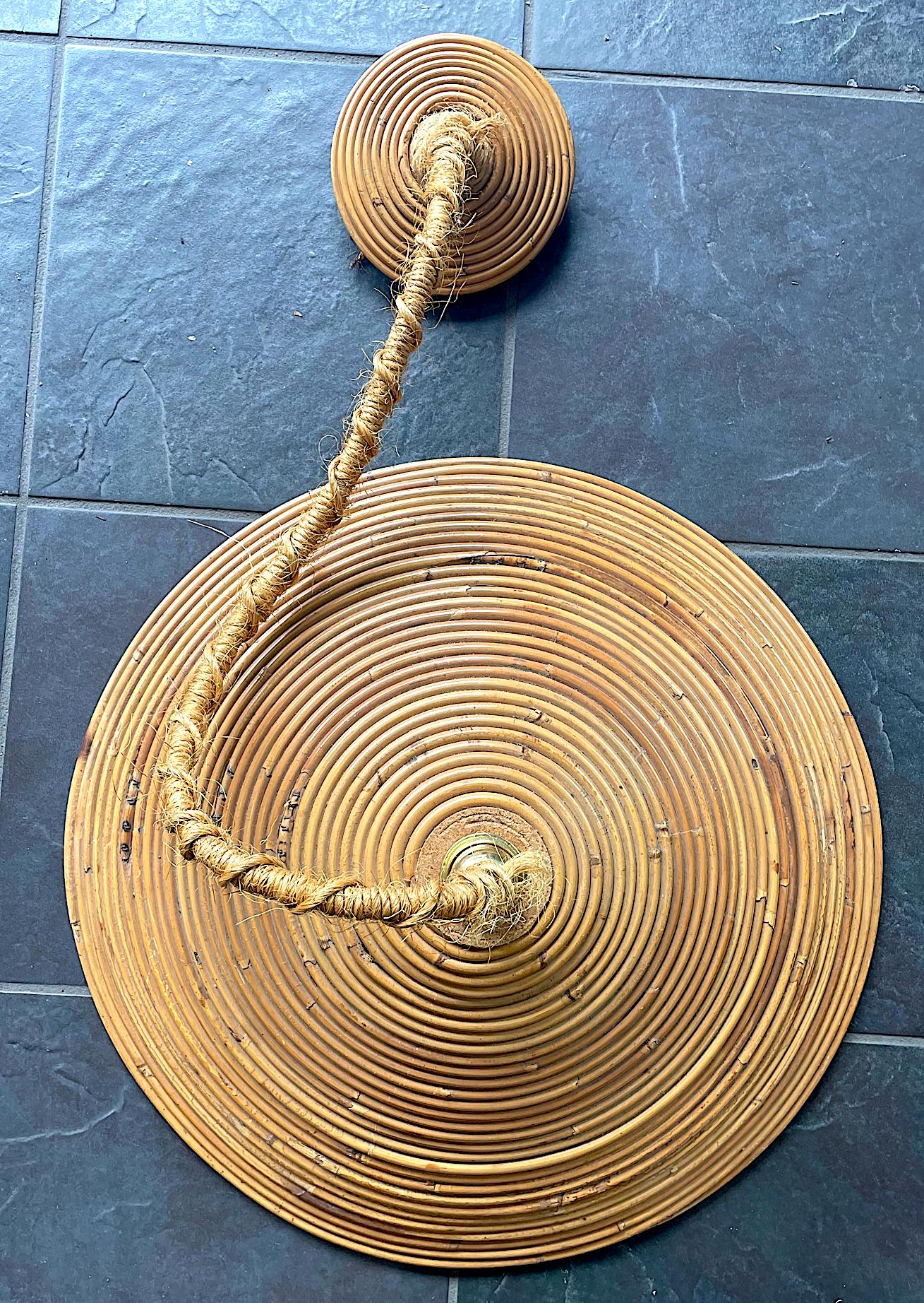 A 1970s Italian bamboo circular pendant light with rope hanging cable and matching bamboo ceiling rose, re wired with new brass fittings and PAT tested.