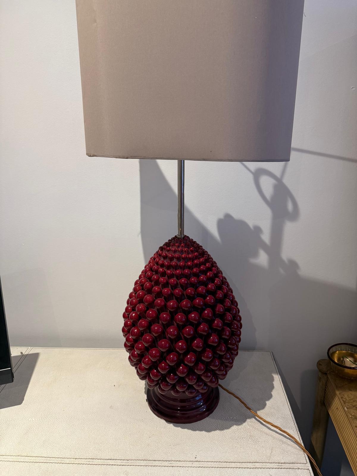 A 1970's Italian  glazed ceramic table lamp modelled as a bunch of red cherries on glazed ceramic base. Wired to UK standards, lamp shade is not included