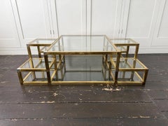 A 1970's Italian Multi-Tiered Brass & Glass Coffee Table