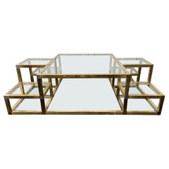 A 1970's Italian Multi-Tiered Brass & Glass Coffee Table