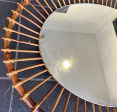 A 1970s Italian oval pencil reed bamboo mirror with orignal mirror plate