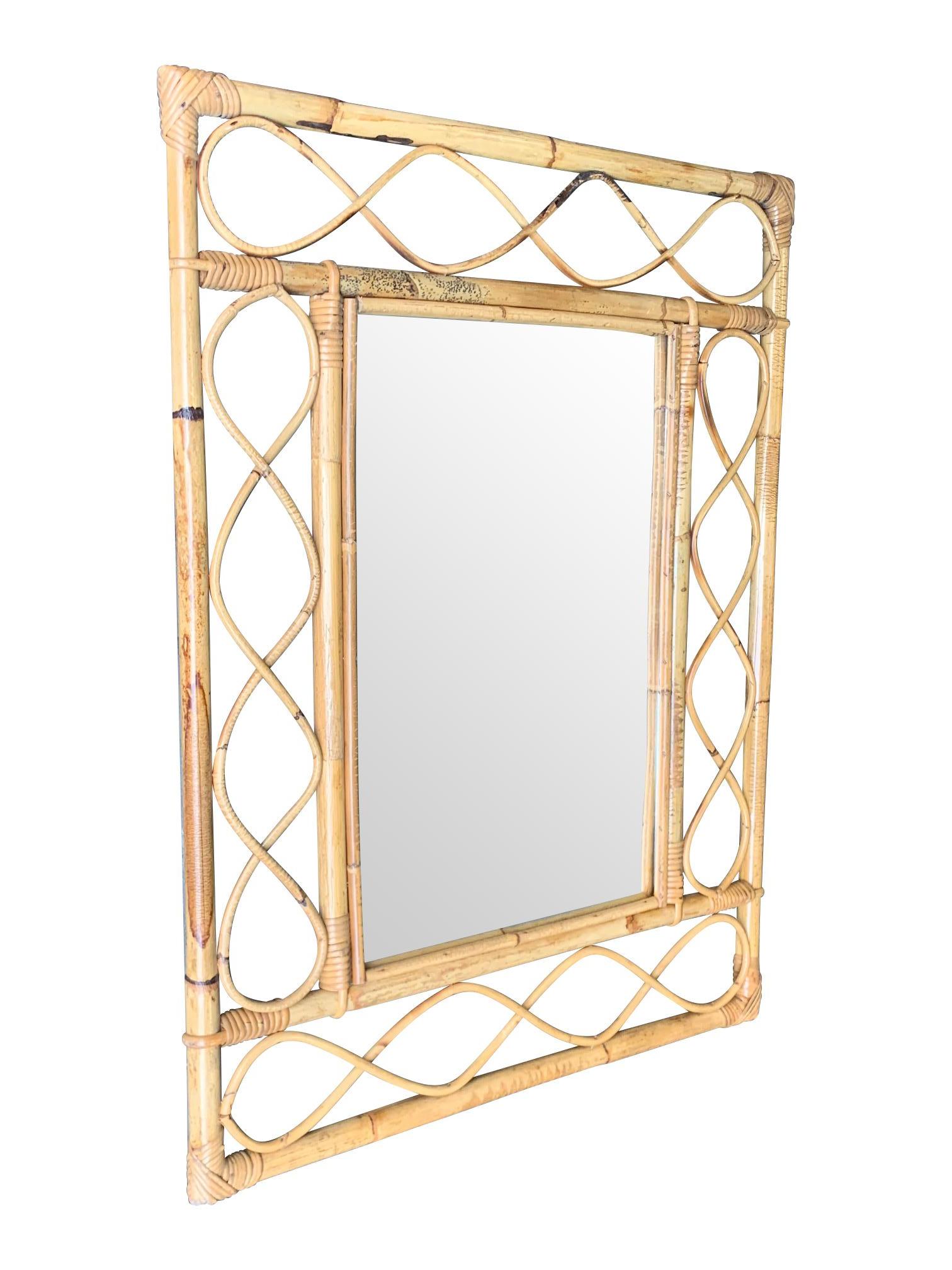 A 1970s Italian Riviera rectangular bamboo mirror with bamboo frame around a central mirror.