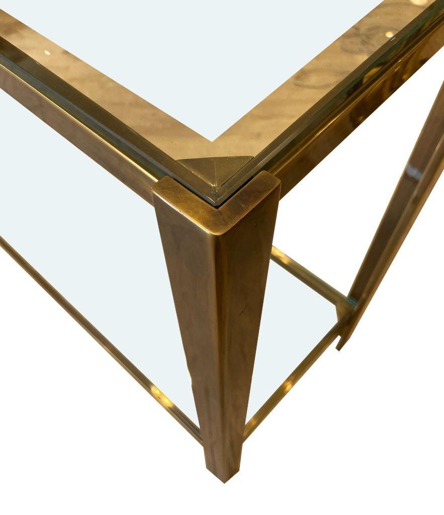 A 1970s Italian solid brass console table with 2 glass shelves 1