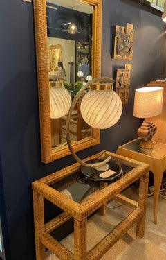 A 1970s Italian woven rattan mirror with matching console table