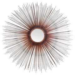 A 1970s large Curtis Jere torch cut copper sunburst mirror