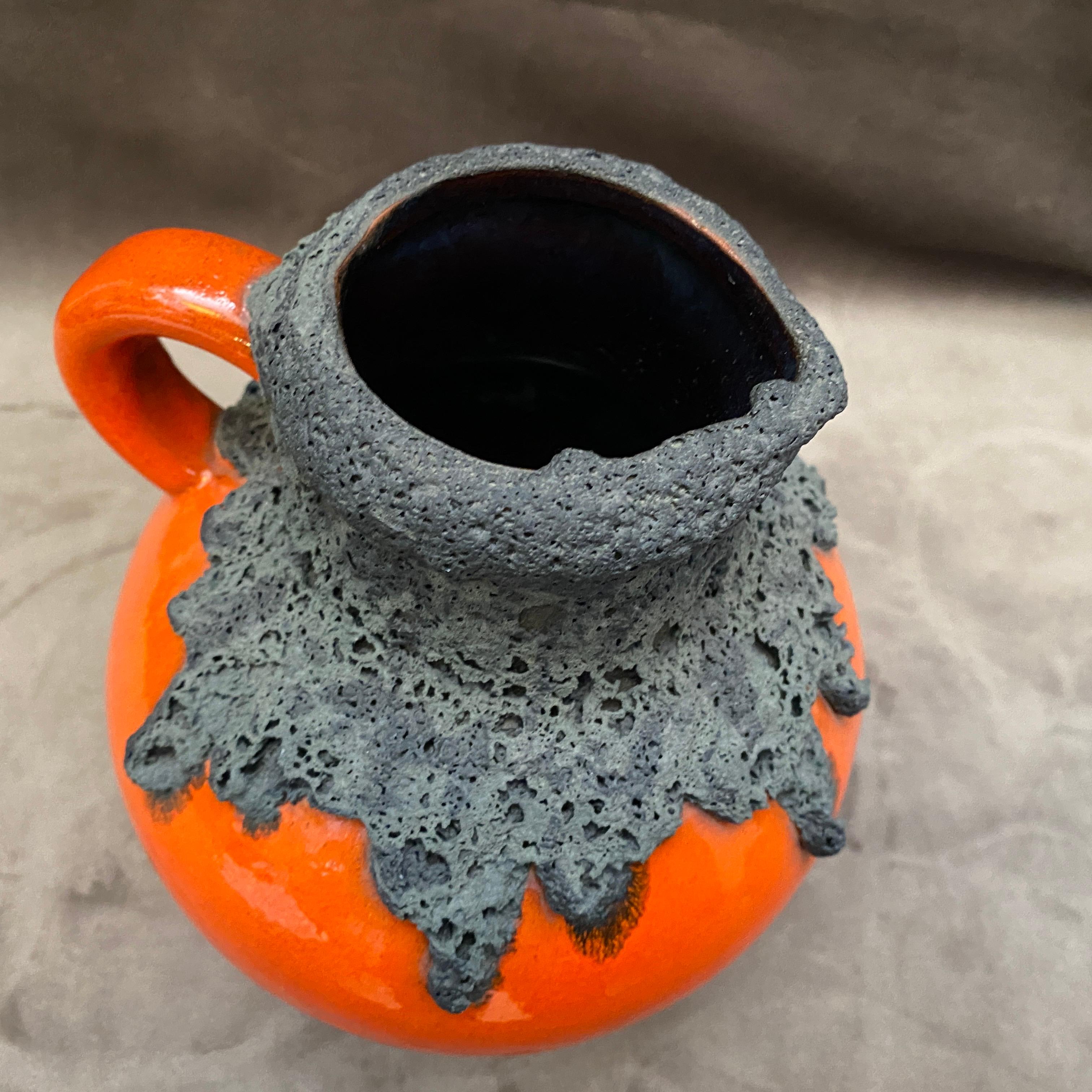 A stylish jug made in Germany by Roth Keramik, orange and black ceramic it's in perfect condition.