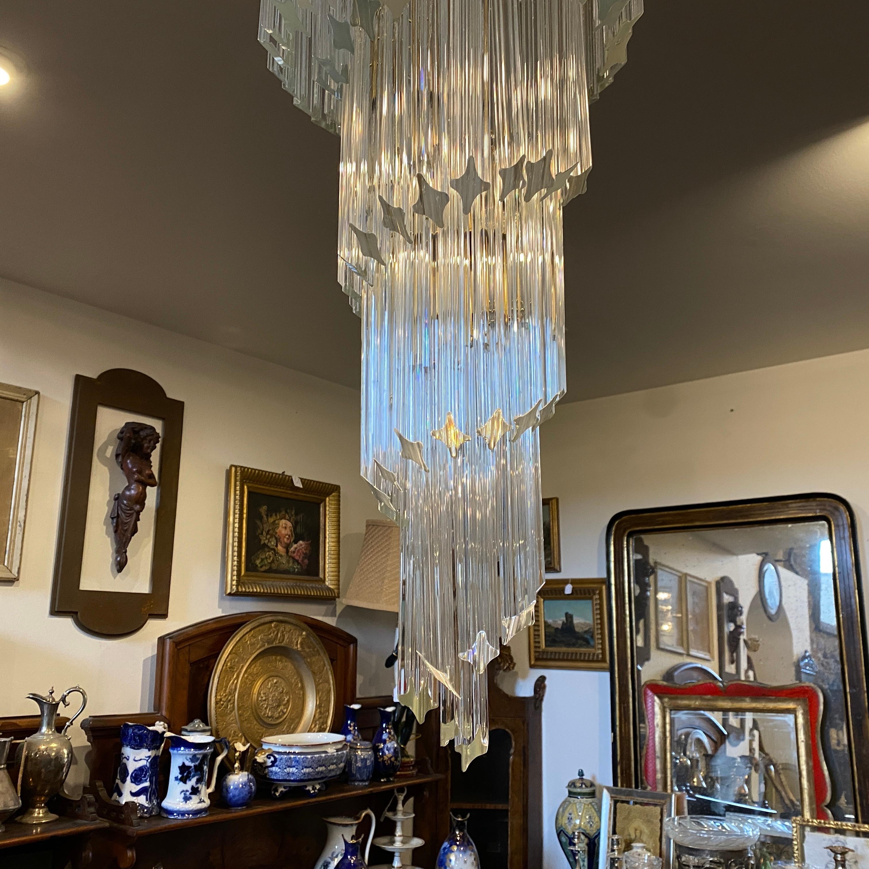 An amazing heavy white Murano glass chandelier in perfect conditions. It works 110-240 volts and needs regular e 14 bulbs. In the pictures the chandelier is not on.