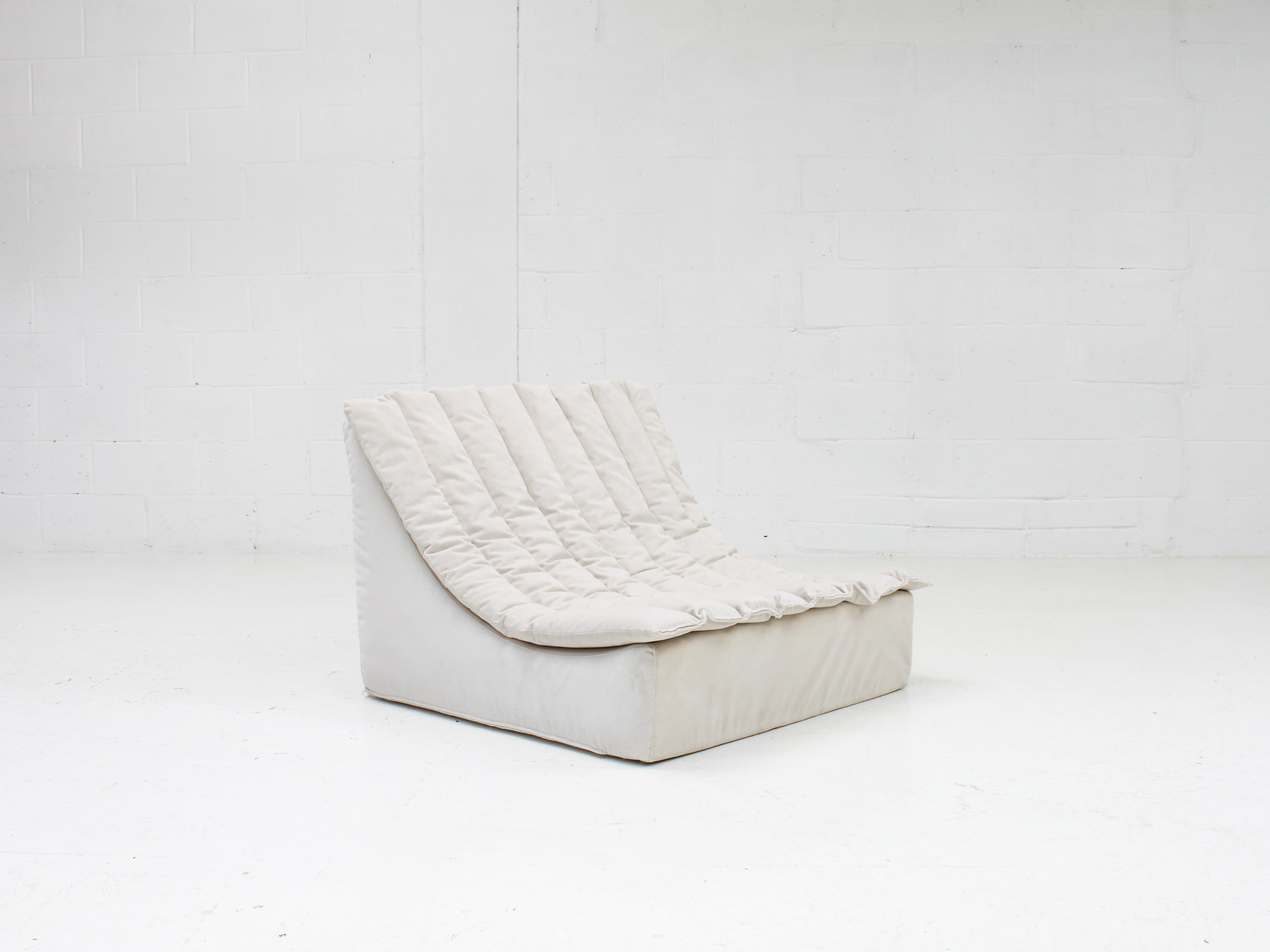 A 'Scoop' lounge chair designed by Martin Sylvester in the 1970s for Habitat, UK.

Amazingly comfortable due to the foam construction and ribbed seat pad. Reupholstered in a chalk coloured velvet.

In very good condition with only very minor signs