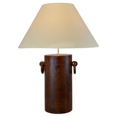 A 1970s table lamp in brutalist style, made of wood and brass - France.