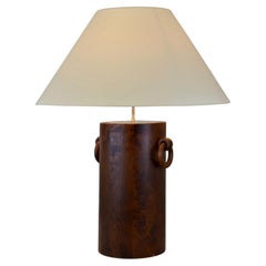 A 1970s table lamp in brutalist style, made of wood and brass - France.