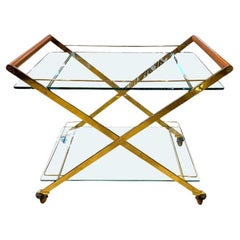 A 1980s Gallotti and Radice “Mister” brass and cherry bar trolley.