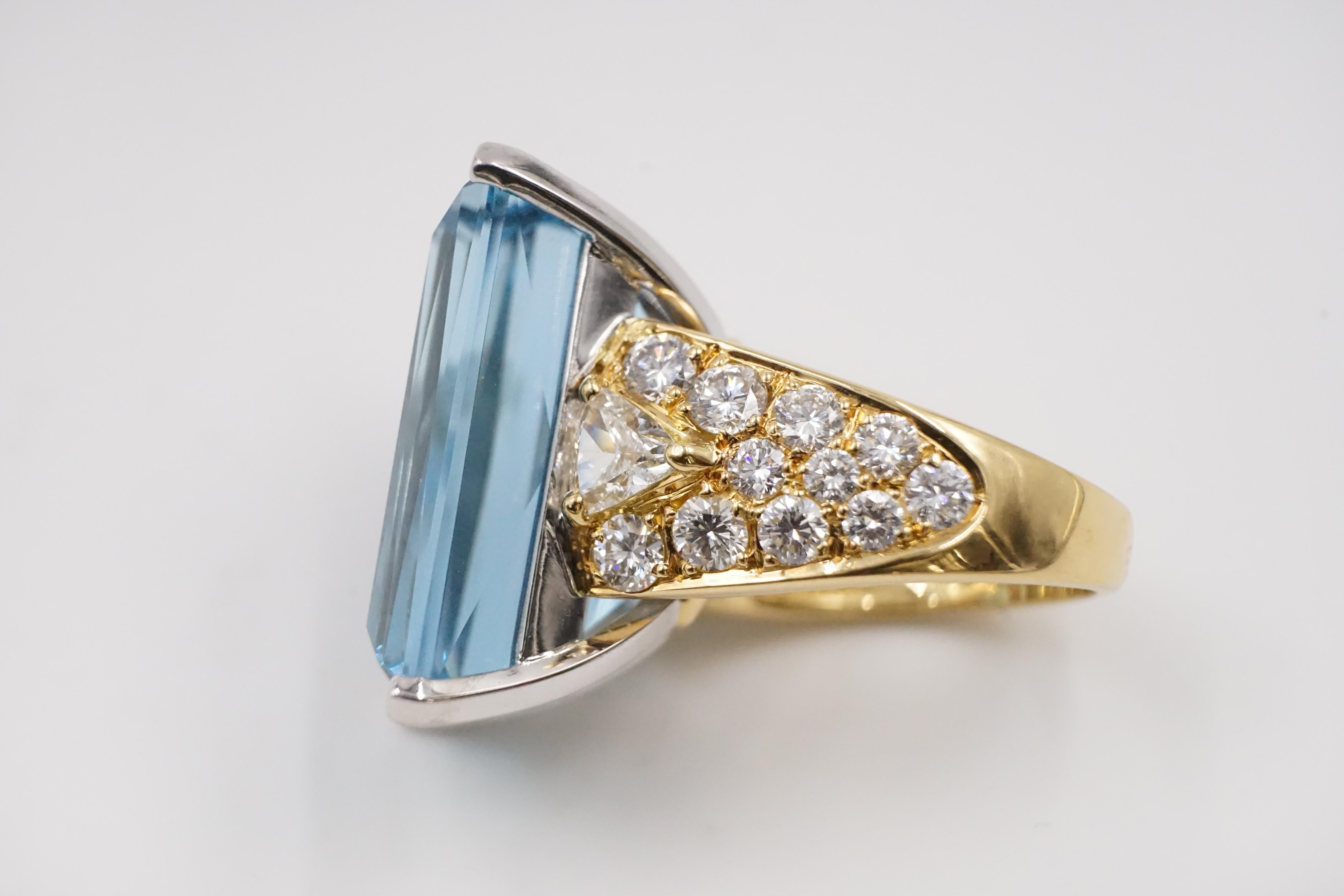 A 1980s large aquamarine, diamond and 18ct gold ring by Repossi the aquamarine itself measures W:1.55cm H: 2.4cm D: approx 1.27cm and weight approx over 40 carat. 

There are 24 diamonds on the shoulder 2 triangle cut and 22 smaller brilliant cut