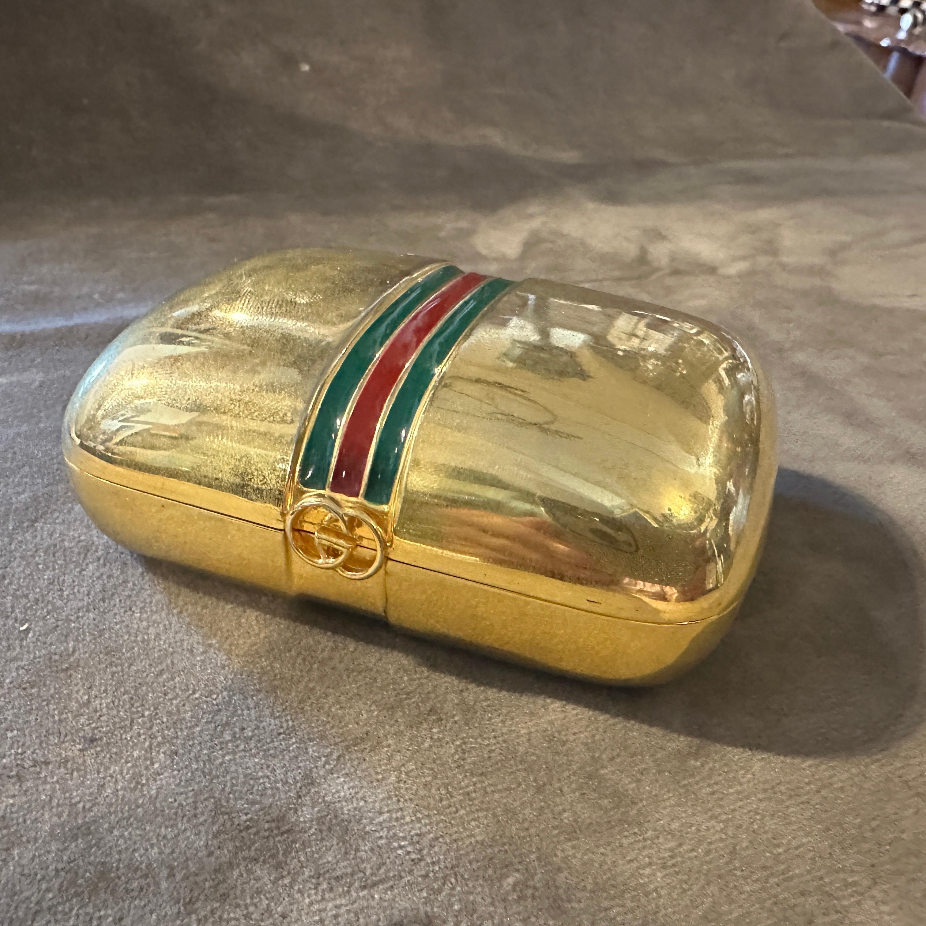 1980s Modern Gilt Brass and Lacquer Small Luxury Box by Gucci
A refined piece of Italian luxury, this 1980s small box by Gucci showcases the brand's iconic blend of elegance and bold design. Crafted from gilt brass, the box features a lustrous gold