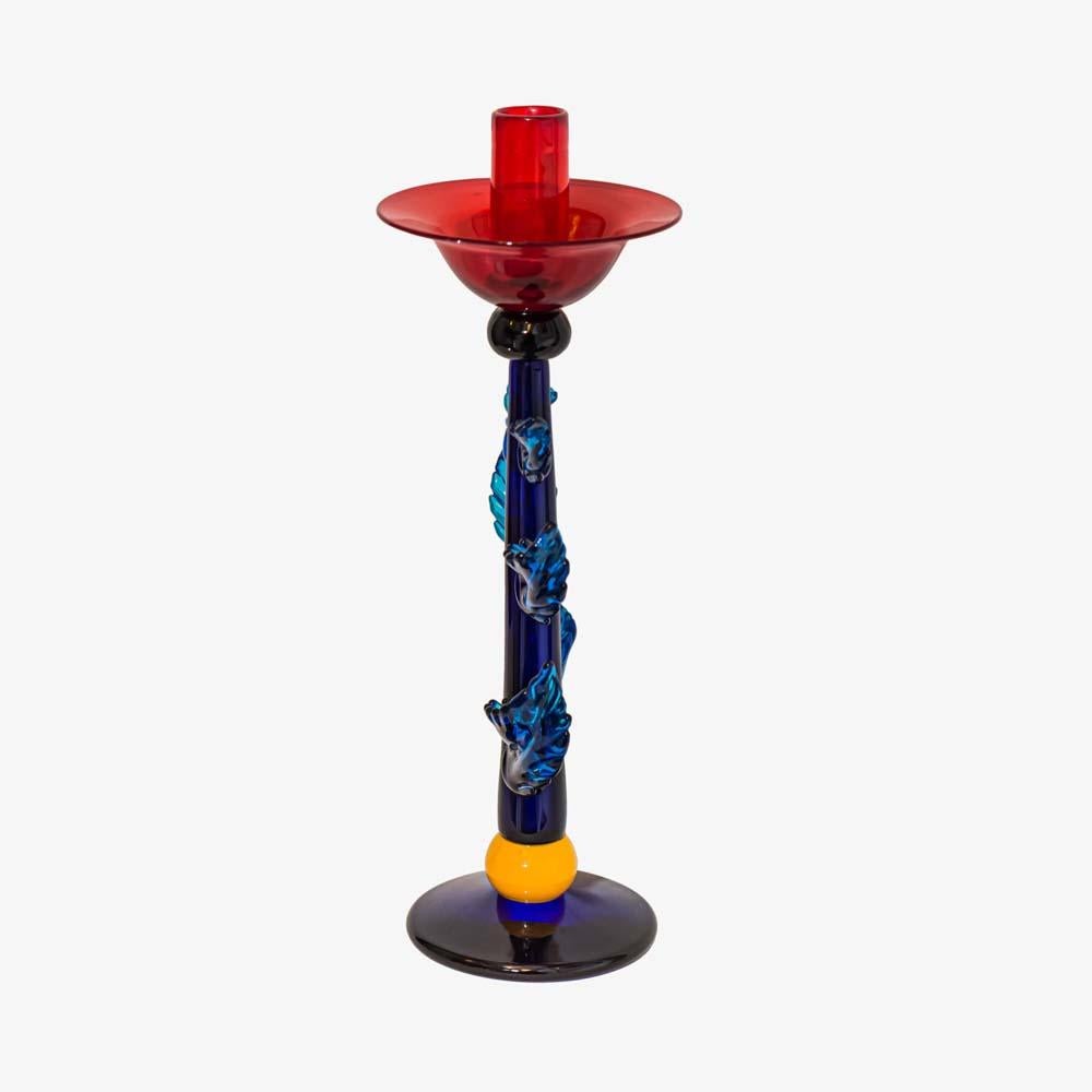 An unique and very charming floral Murano blown glass candlestick a design and work of art by Silvano Signoretto Murano, Venice, Italy 1980s
Blue, green, red blown glass with yellow rim on top of the pedestal.
A very beautiful rare work by the