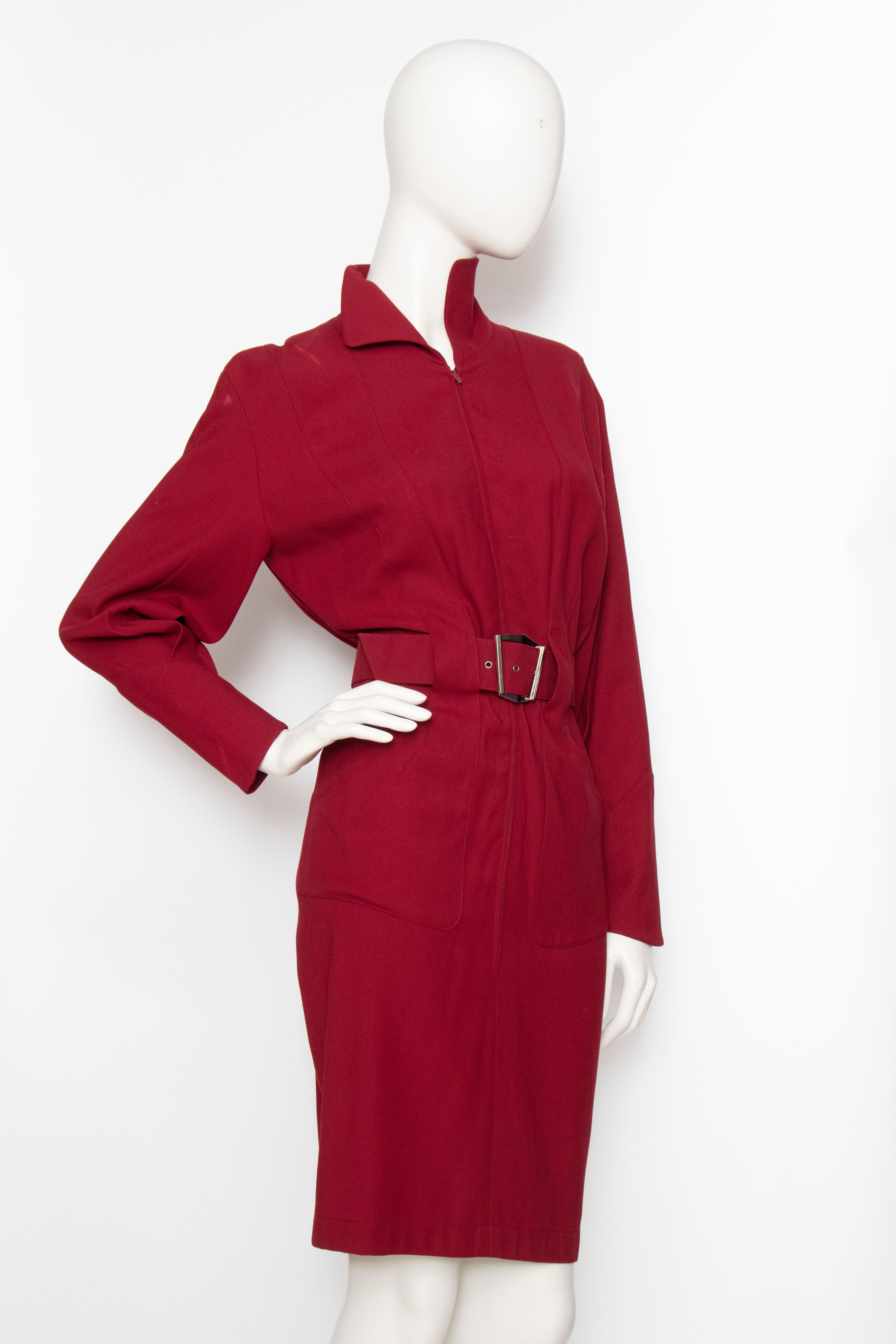 A fabulous 1980s Thierry Mugler wine red wool dress with a fitted wasp waist, pencil skirt and long sleeves with fitted cuffs. The dress is fully lined and has a matching waist belt with a characteristic graphic silver buckle. 

The size of the