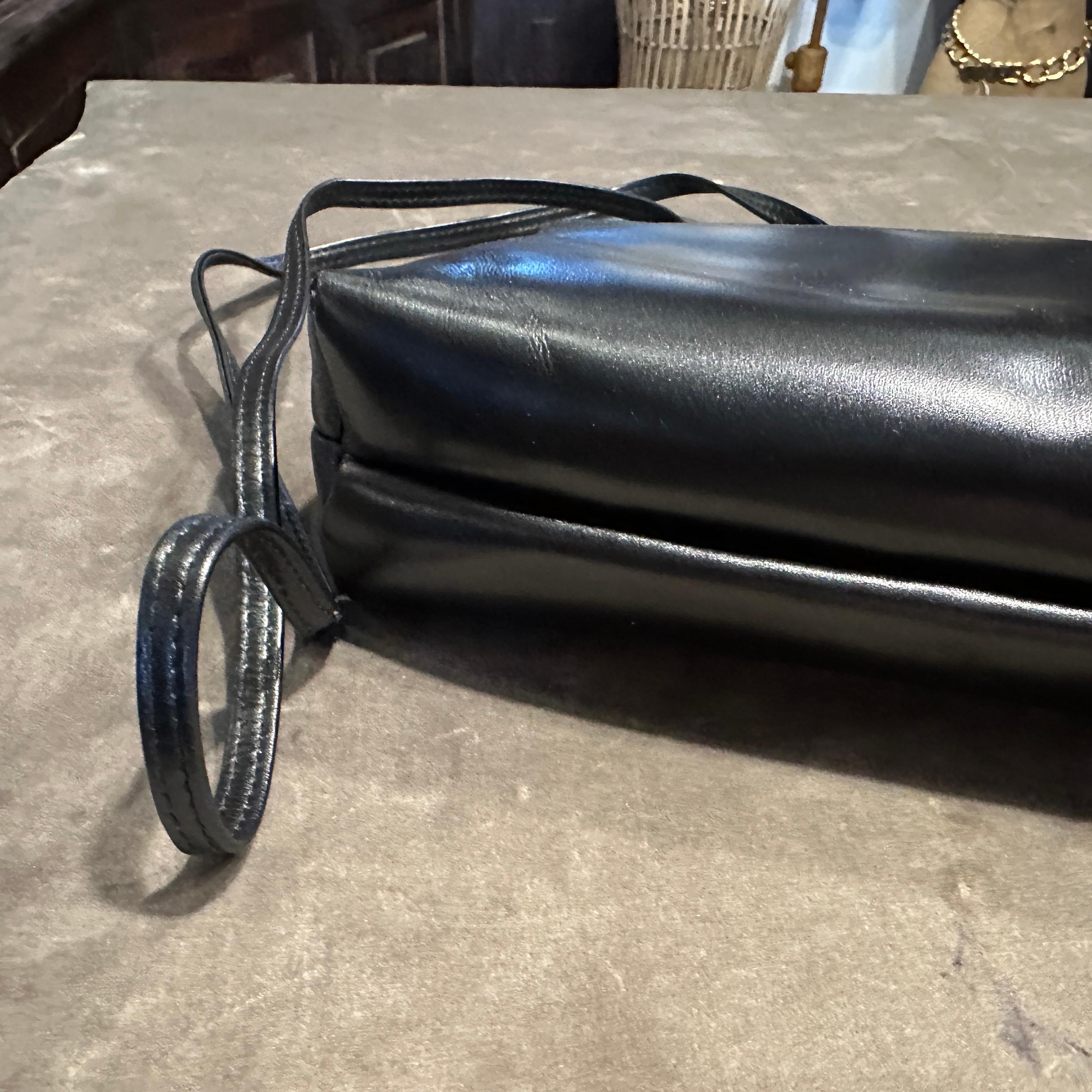 A 1990s Black Leather and Brass Shoulder Bag by Salvatore Ferragamo For Sale 2