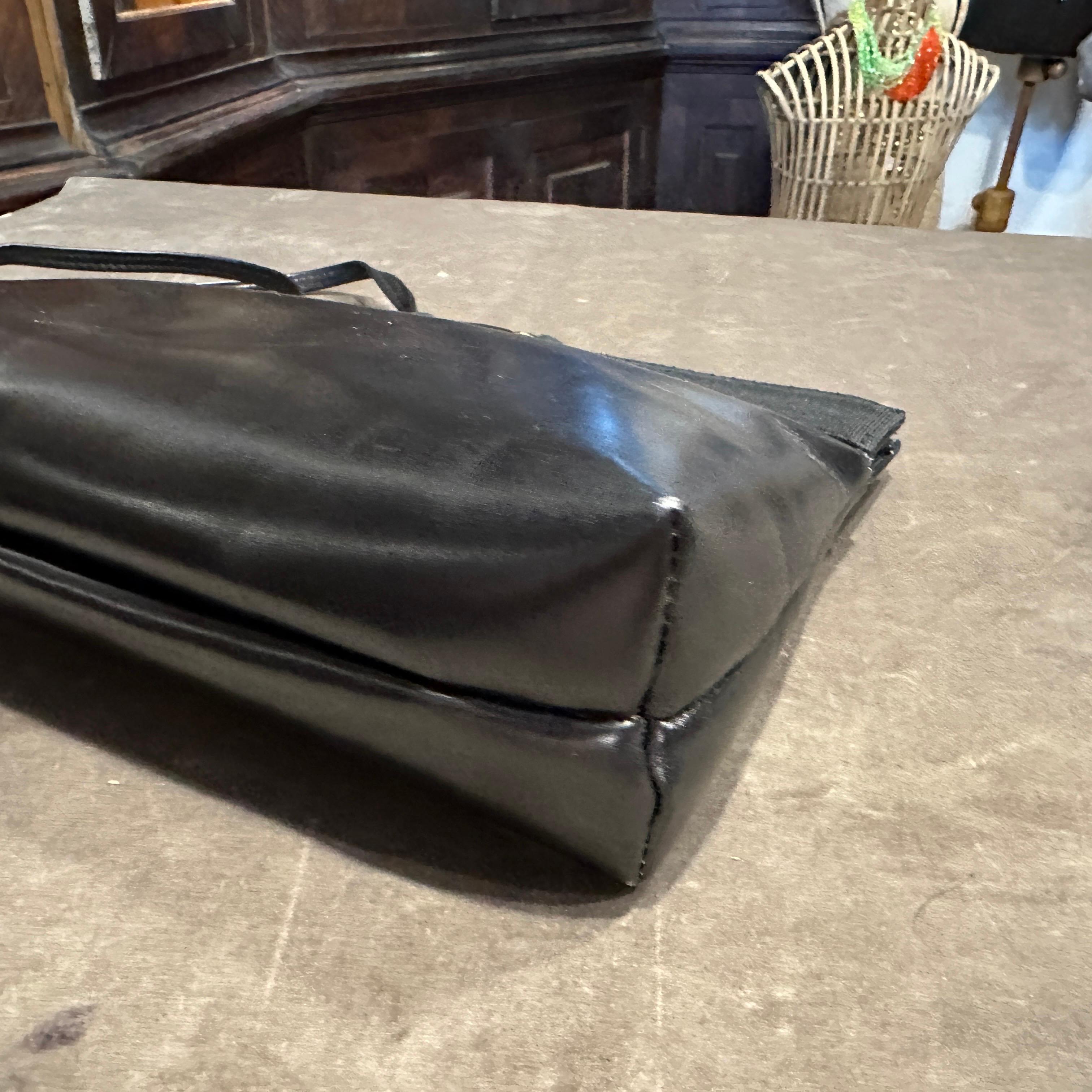 A 1990s Black Leather and Brass Shoulder Bag by Salvatore Ferragamo For Sale 4