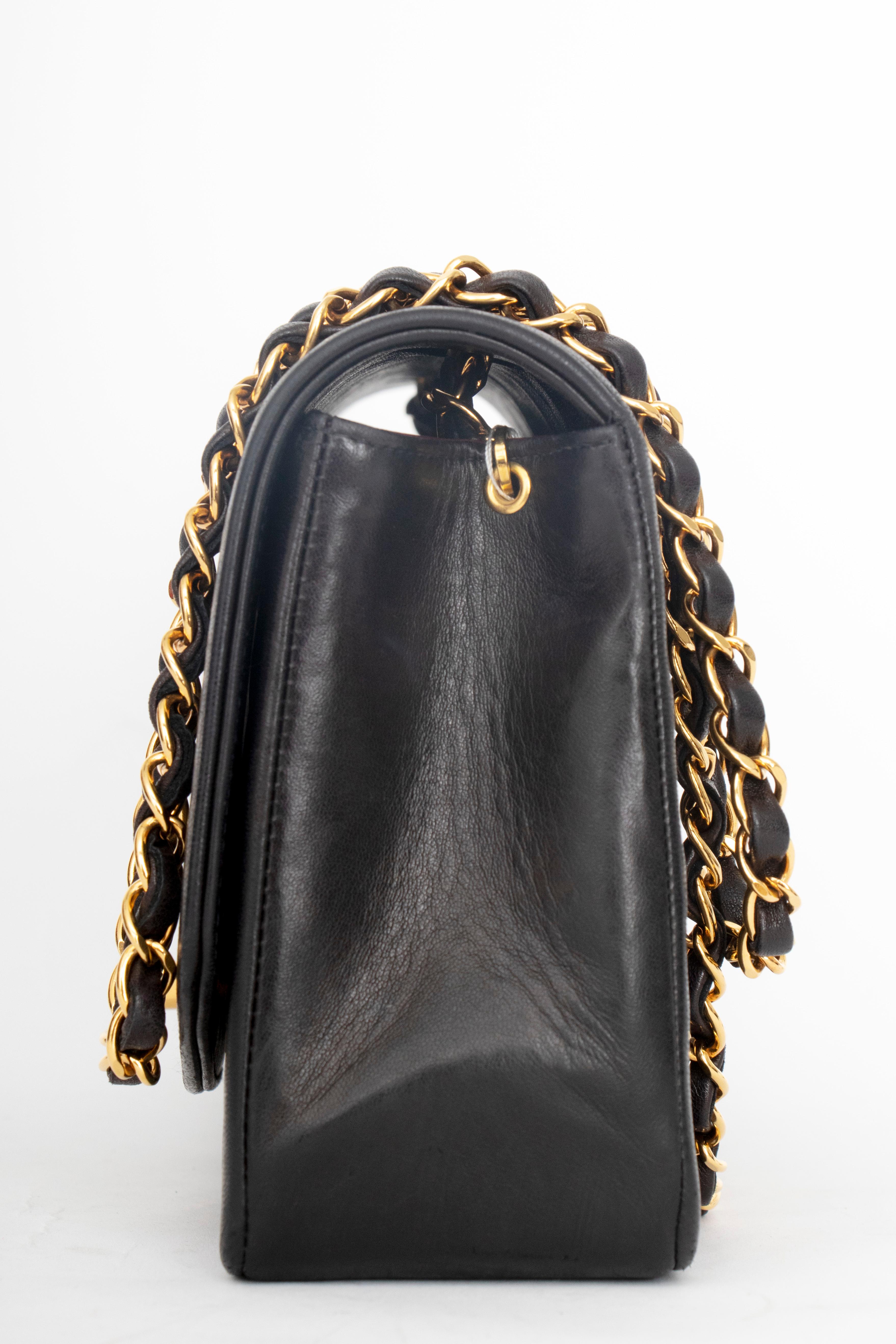 A 1990s Chanel black quilted lambskin shoulder bag with gold hardware. 

The bag has the following measurements:
Length: 25 cm
Depth: 7.5 cm
Hight: 15 cm
