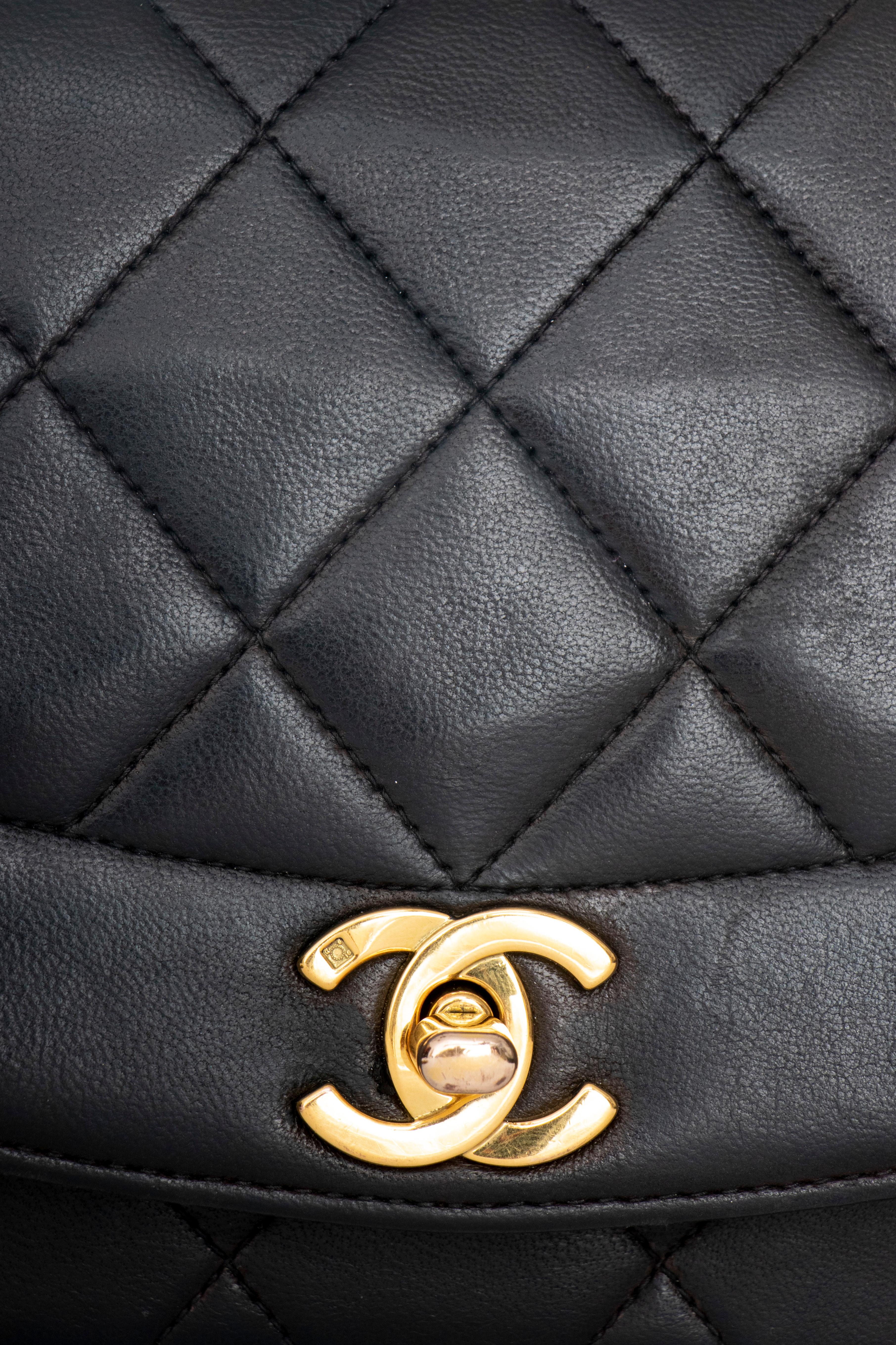 A 1990s Chanel black quilted lambskin shoulder bag with gold hardware.  
The bag has the following measurements:
Length: 22 cm
Depth: 7 cm
Hight: 13.5 cm