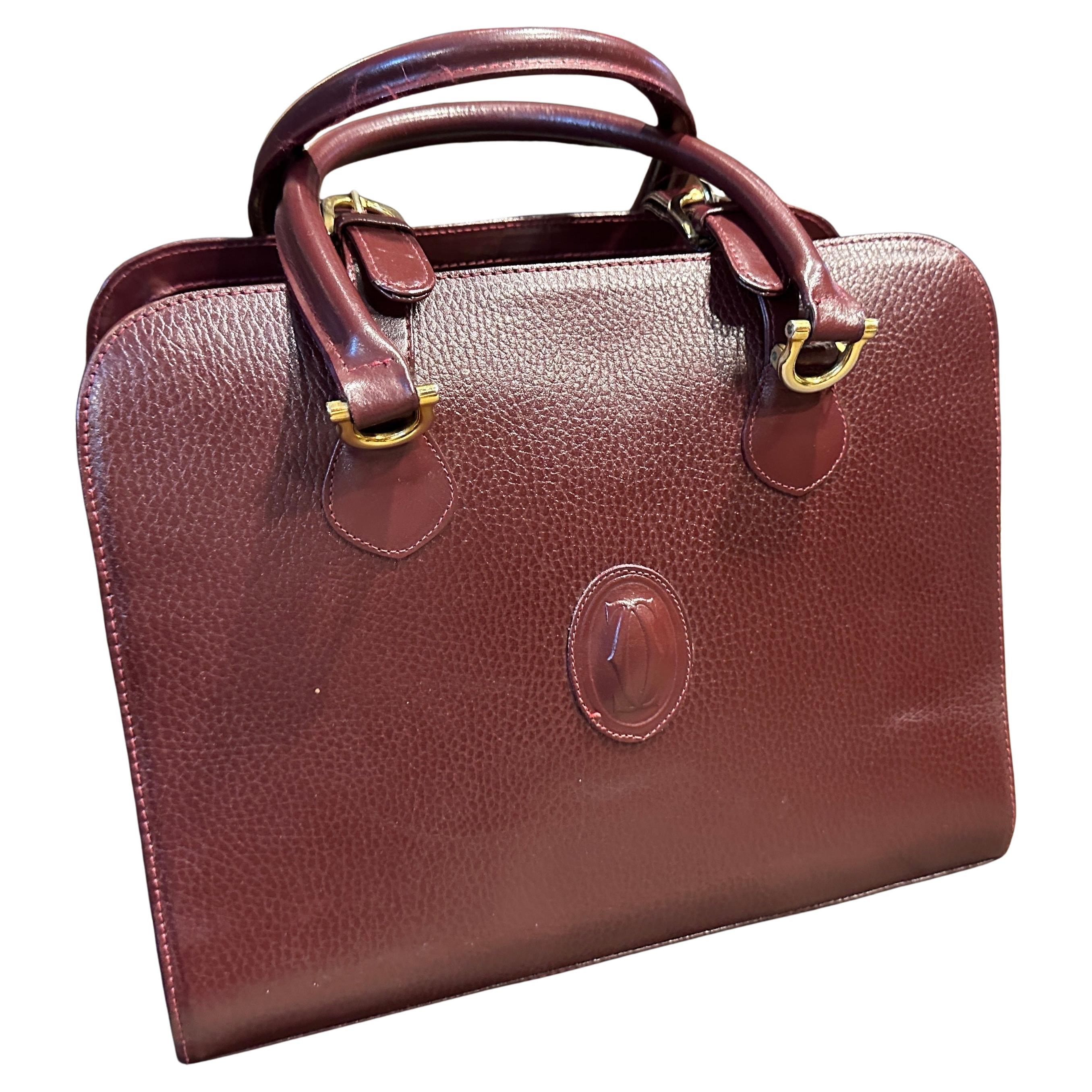 A 1990s Elegant Bordeaux Leather and Brass by Cartier For Sale