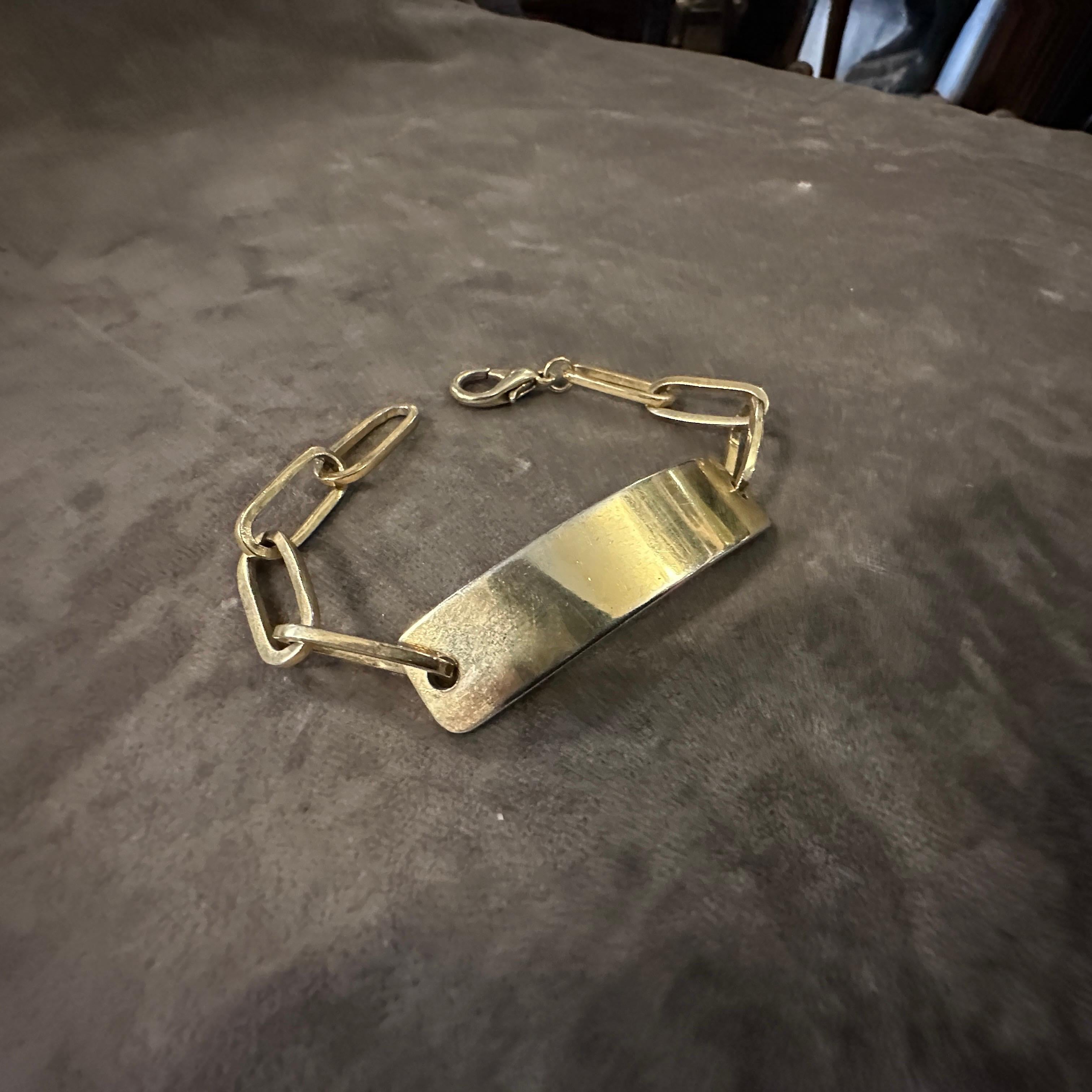 A 1990s Iconic Gilded Metal Bracelet by Emilio Pucci In Excellent Condition For Sale In Aci Castello, IT