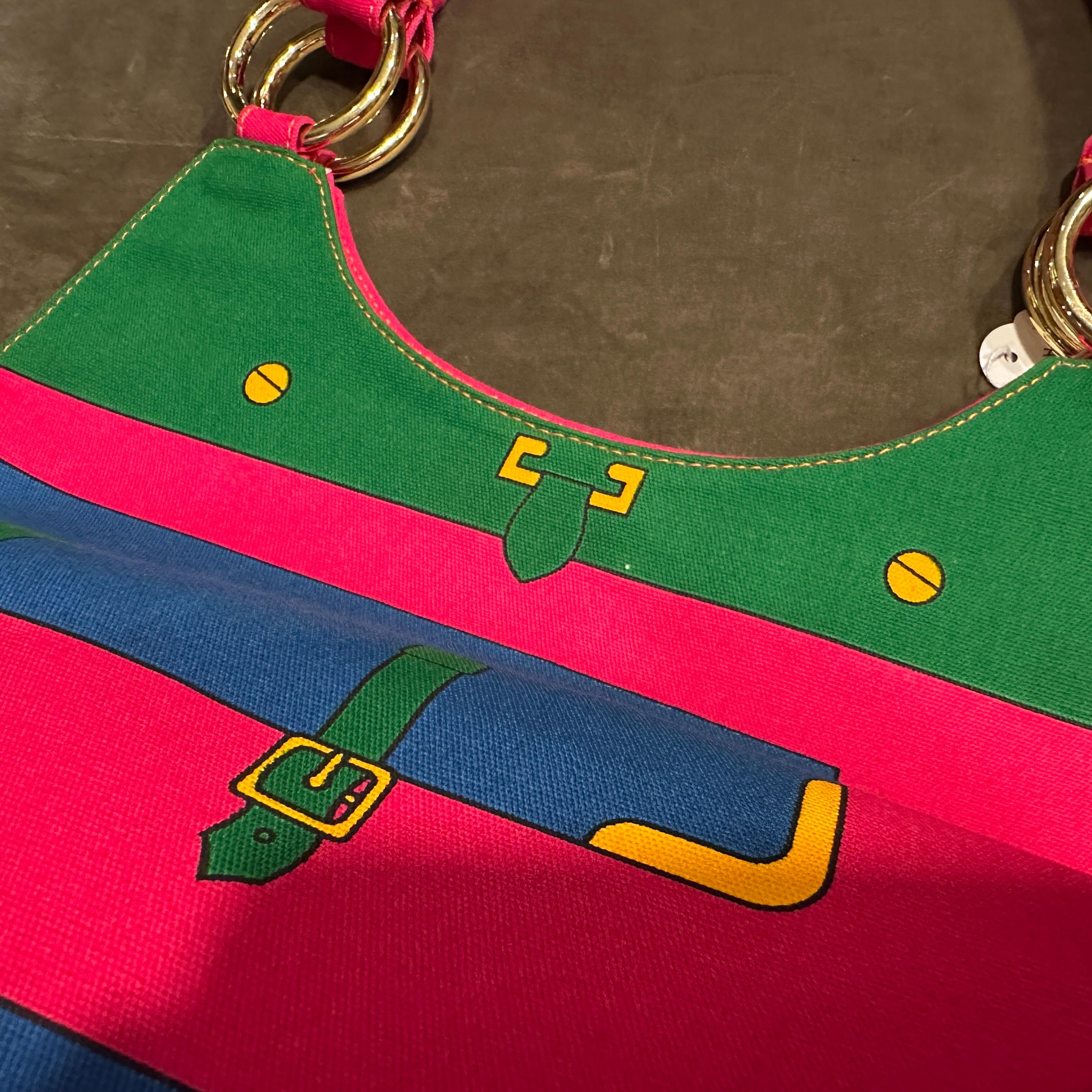 Never Used  1990s Roberta di Camerino Vibrant Pink & Green Fabric Top Handle Bag
This striking and rare 1990s Roberta di Camerino top handle bag is a true testament to the brand's playful elegance and innovative design. In never-used condition, this