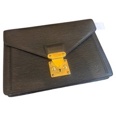A 1995 Louis Vuitton Poche Dragonne Blak Epi Leather Clutch