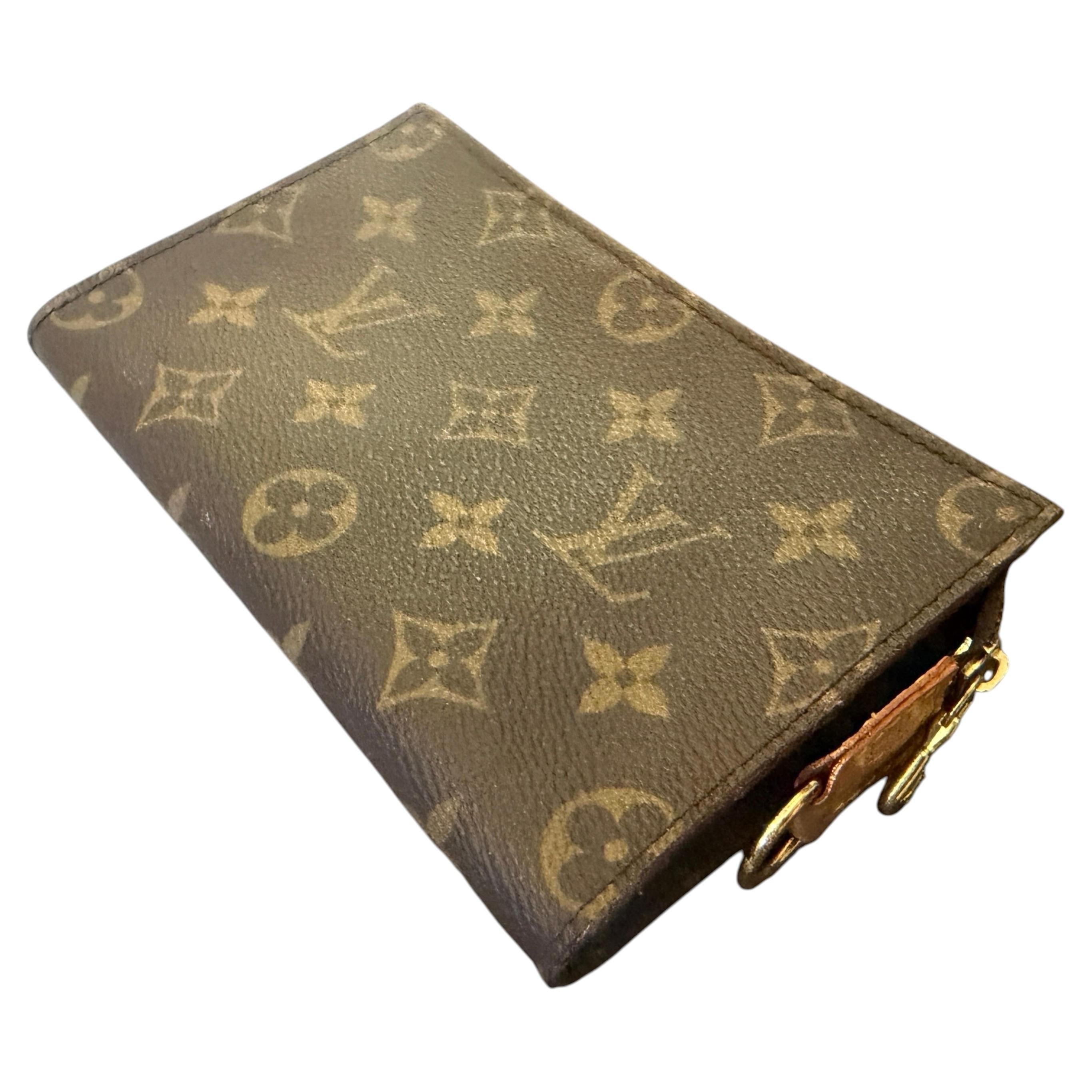 How do I put a strap on a Louis Vuitton wristlet?