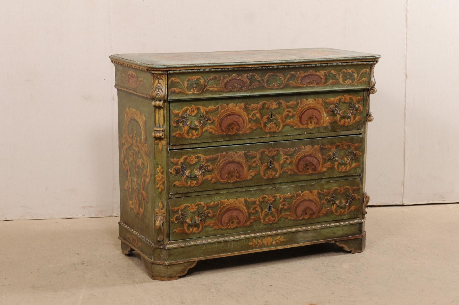 A Central European chest, with its original decorative paint, from the 19th century. This antique chest of drawers from Europe is beautifully adorned in its original hand painted artisan finish in a rinceaux of elegant scrolling acanthus leaves and