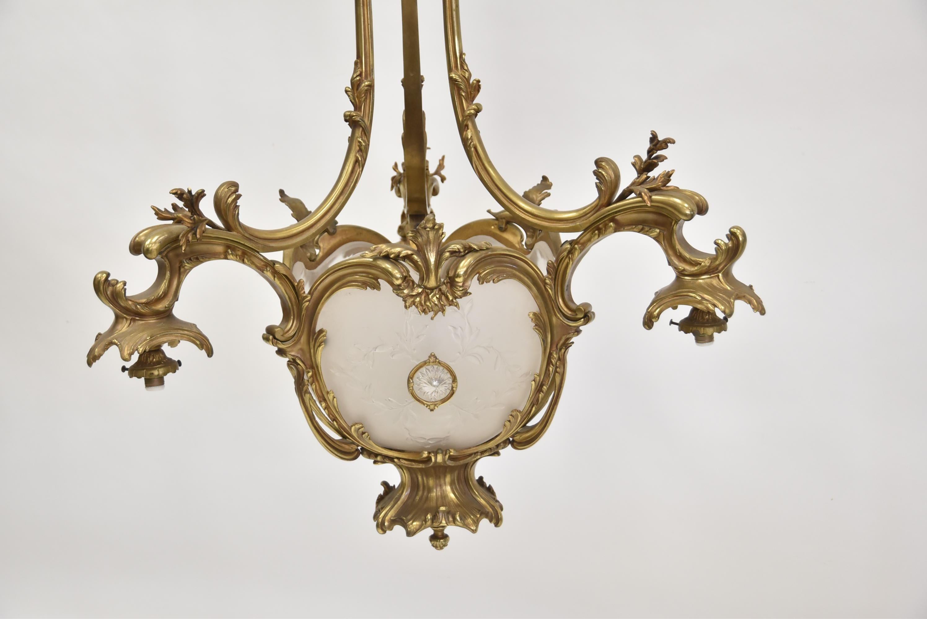 A fine 19th century French gilt bronze Louis XV style chandelier. Lalique style frosted glass inserts. 3 lights.