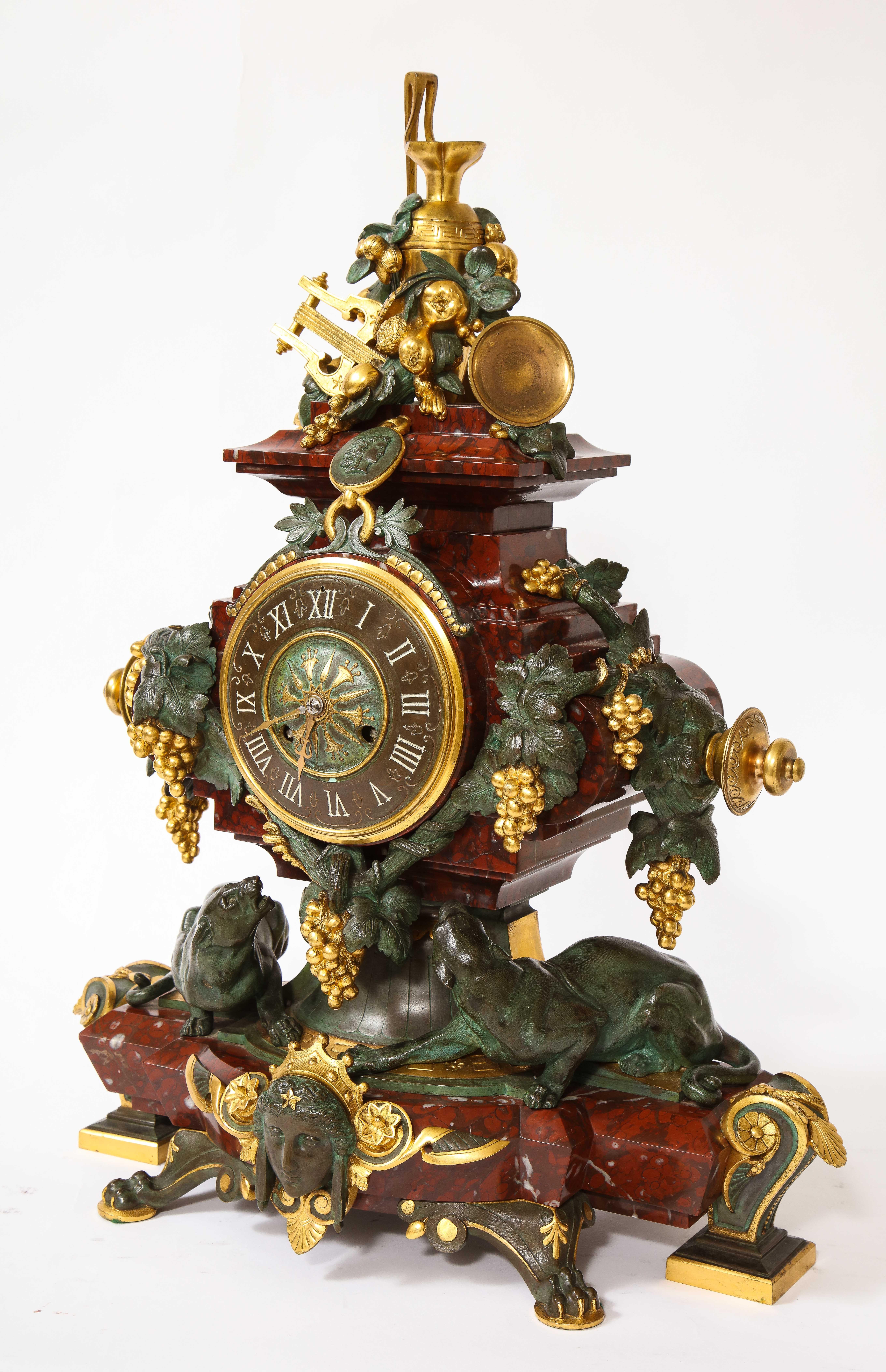 A 19th C. French Patinated Bronze & Ormolu Mounted Rouge Marble Clock Garniture In Good Condition For Sale In New York, NY