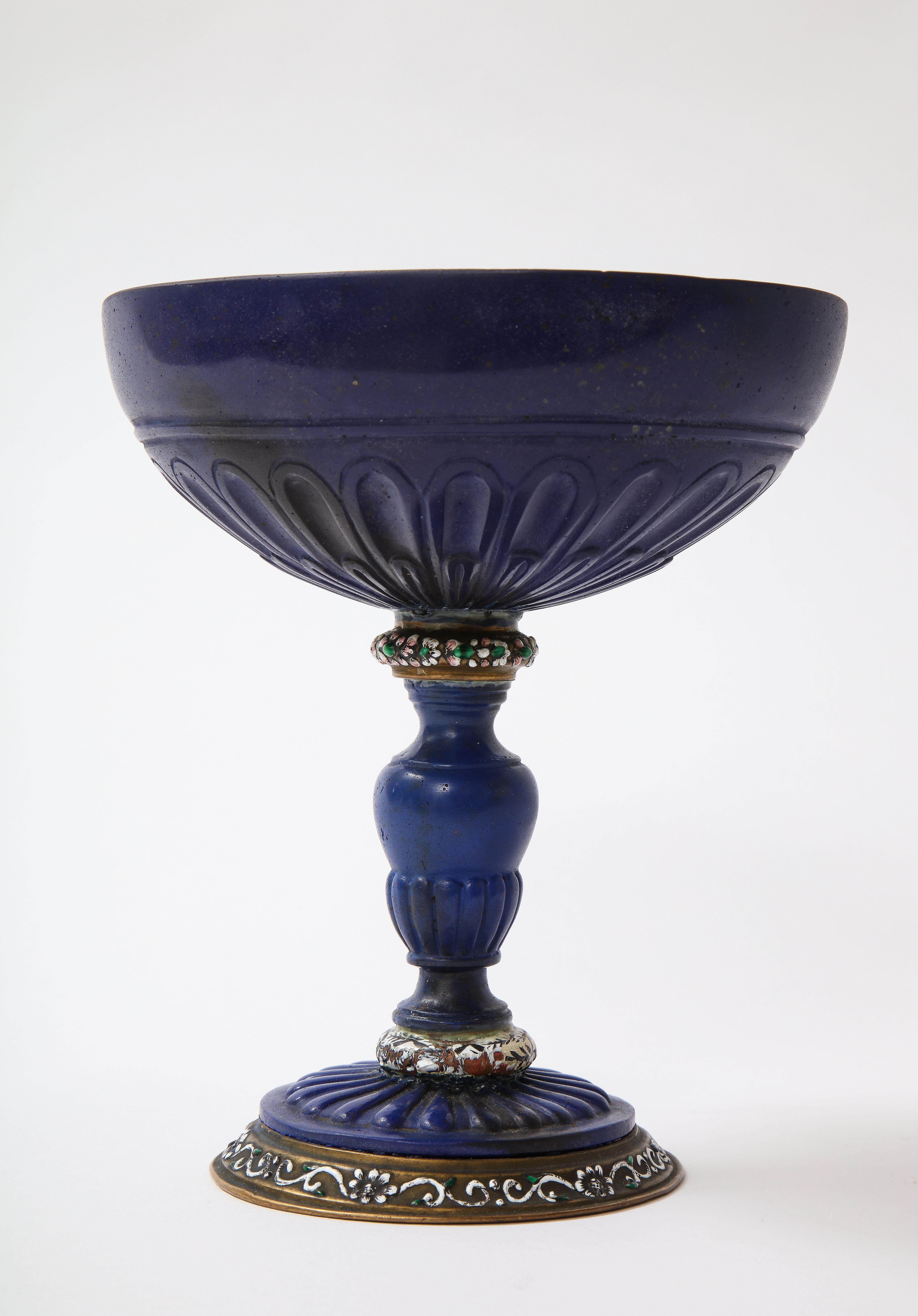 A Magnificent 19th Century Italian Dore Bronze Mounted Champlevé Enamel and Lapis Lazuli Coupe. This remarkable creation stands as a testament to impeccable artistry, as showcased by the intricate detailing that embellishes this extraordinary