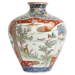 Japanische Kutani-Porzellanvase mit rotem Grund und Kartusche aus dem 19.