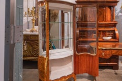 A  19th c Louis XV  satinwood vitrine with floral marquetry signed E Leviell
