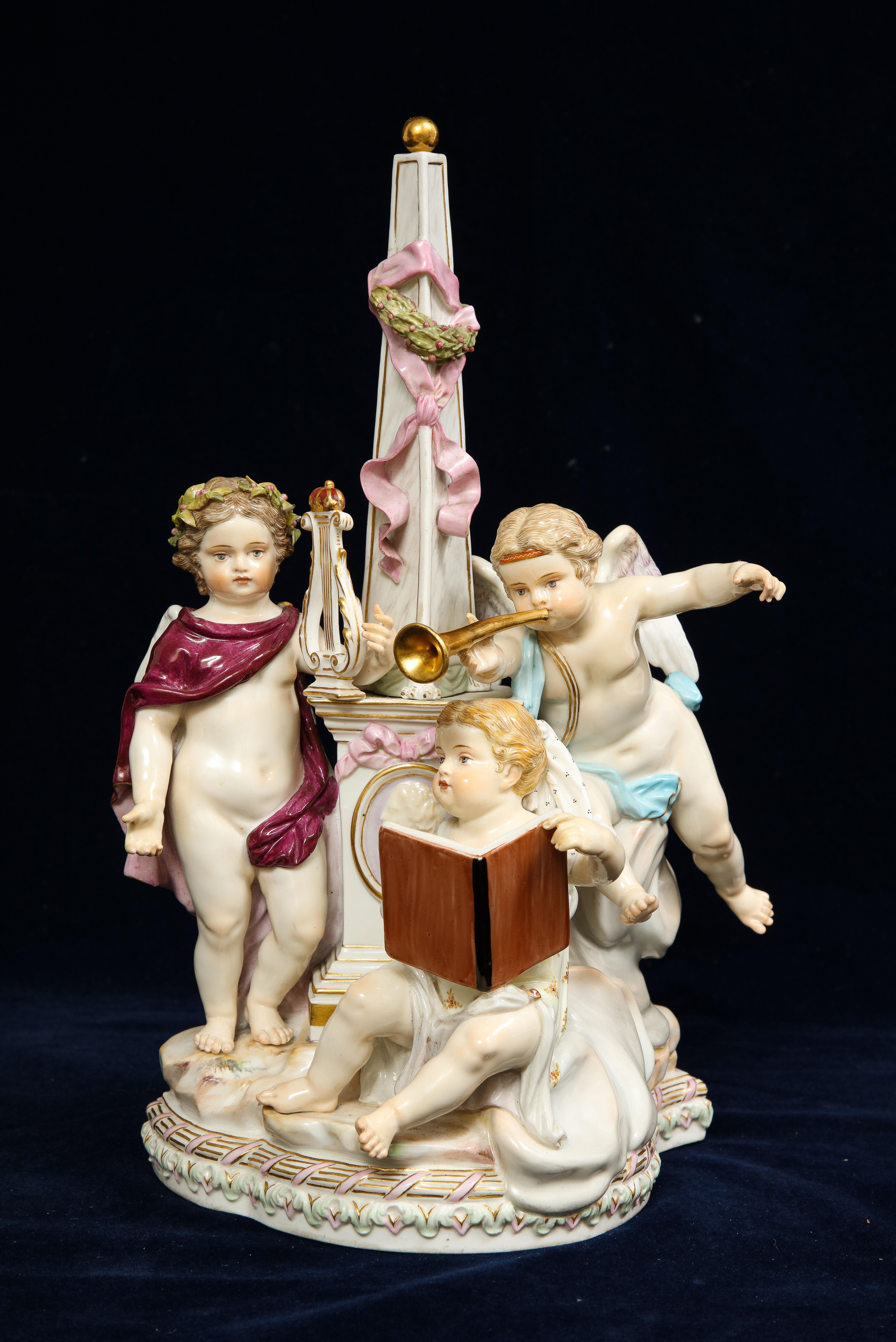 A Beautiful 19th century Meissen Porcelain allegorical grouping of three putti with musical Motifs. One putti is seen with a trumpet in his hand, the other putti is seen playing a lyre, and the final seated putti is seen holding a book with with a