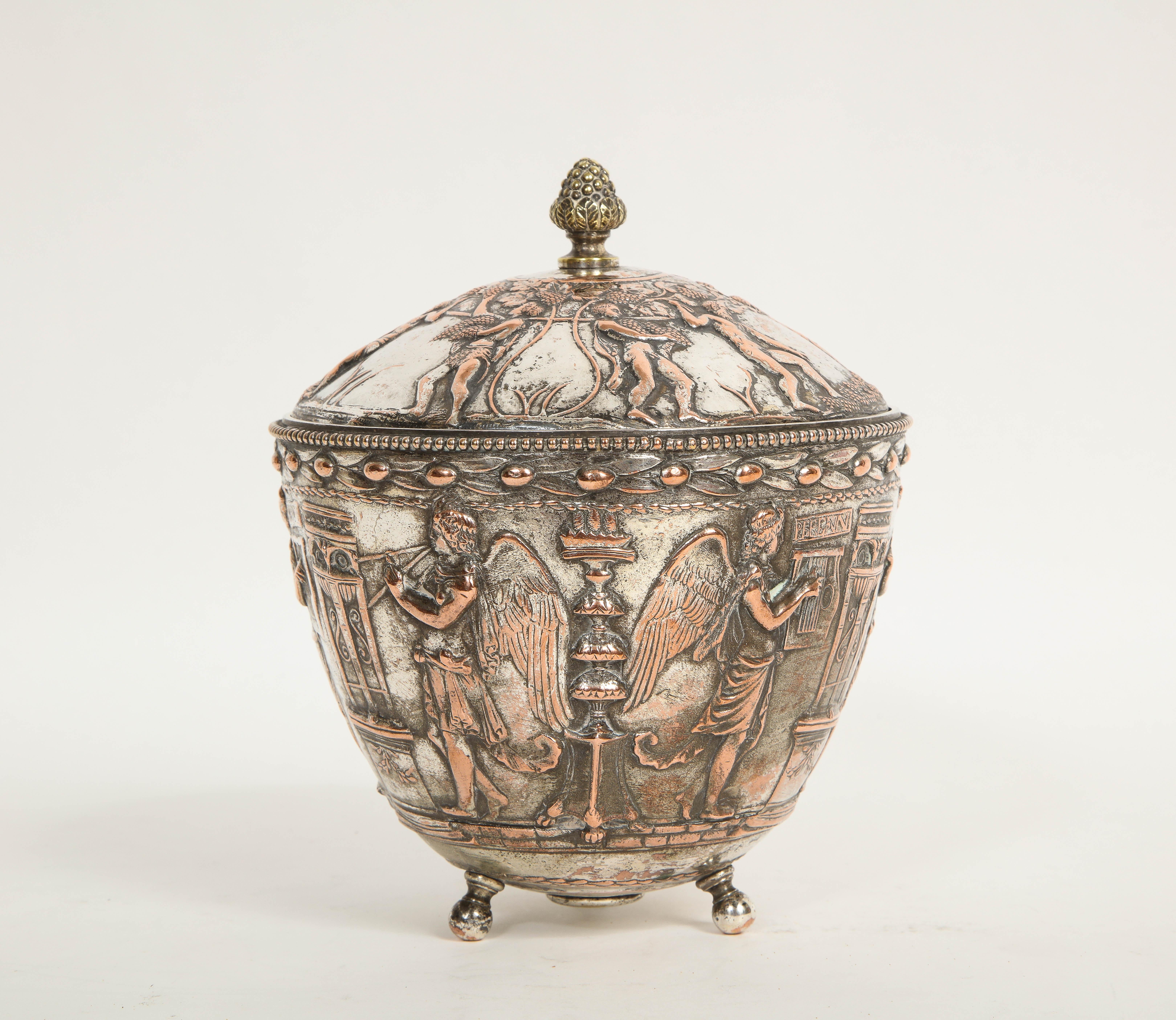 A Fantastic 19th Century silvered bronze neoclassical/archeological style covered bowl, Attributed to E.F Caldwell. The bowl and cover are each beautifully hand-chased and hand-chiseled. The bowl is decorated in neoclassical/archeological, Roman