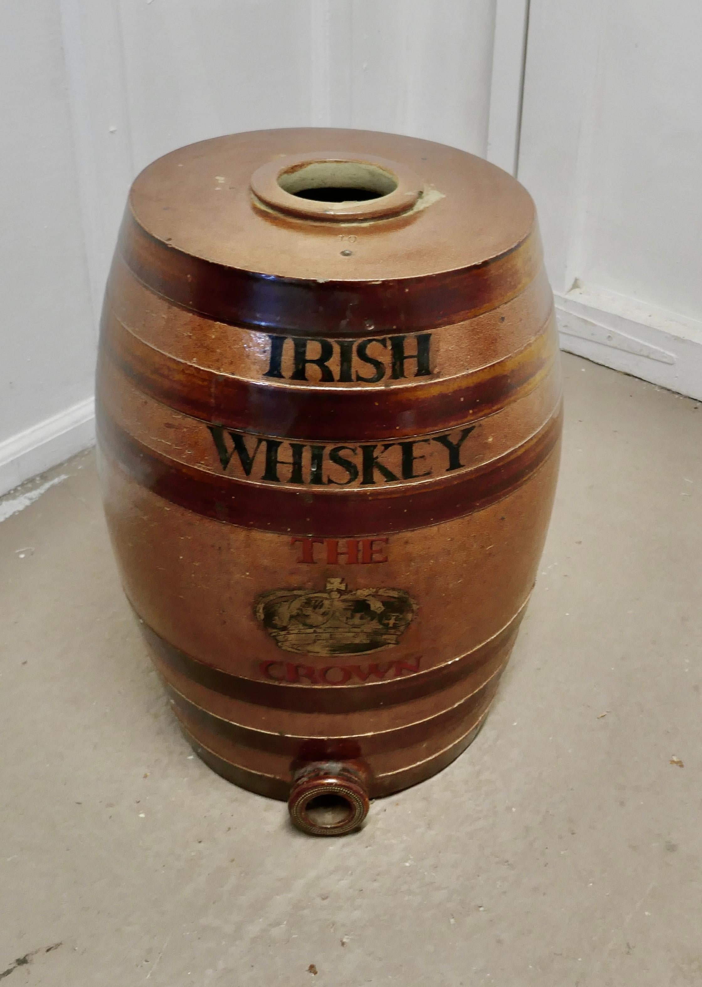 A 19th century 10-gallon stoneware Irish whiskey barrel, from the Crown Inn

A very large stoneware whiskey barrel it is in good condition with minor chips, it has the traditional hooped design and it has a socket for a tap at the bottom

This