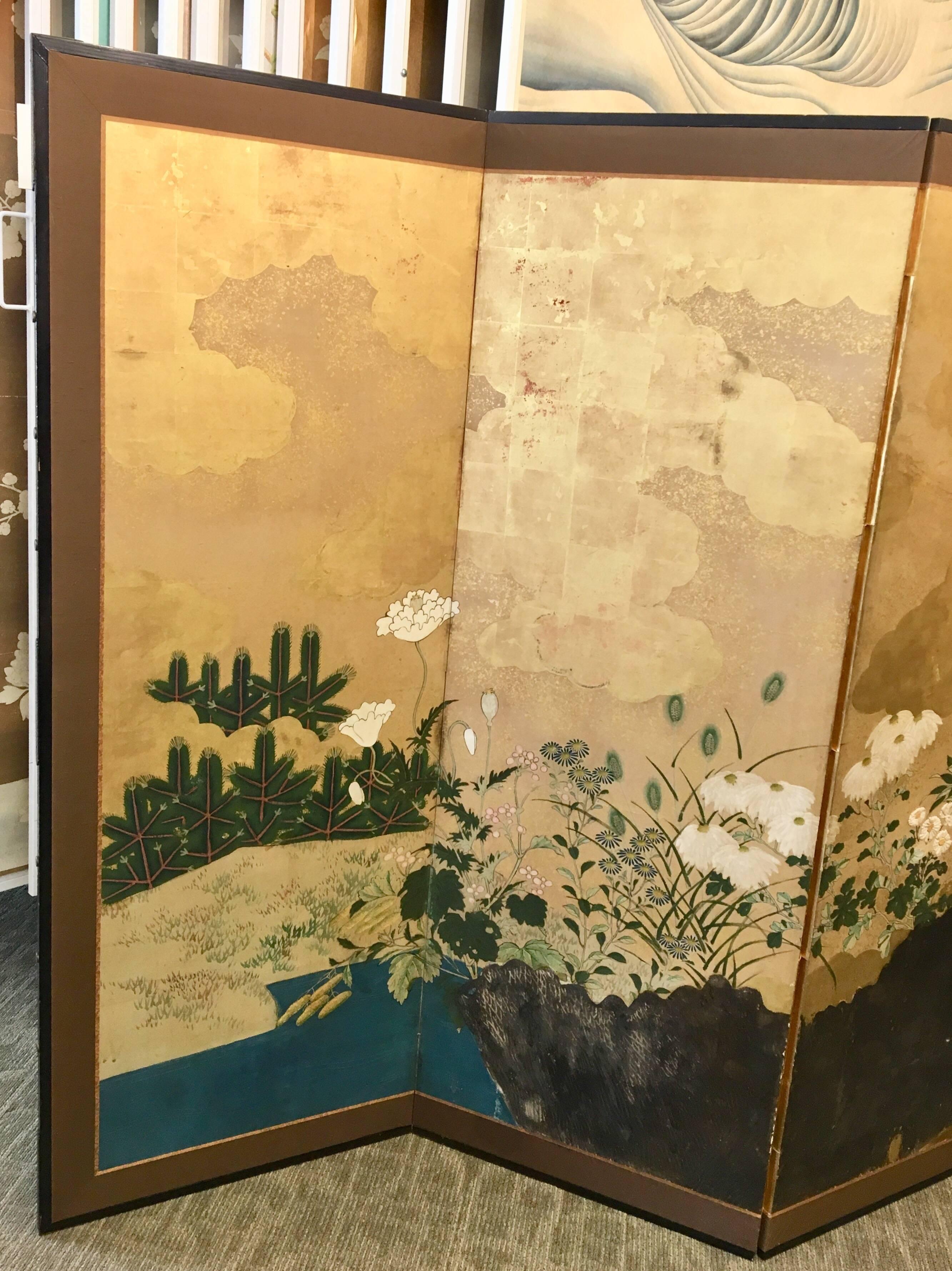 A six-panel Japanese screen with raised fence in gesso. Hand-painted on gold leaf.