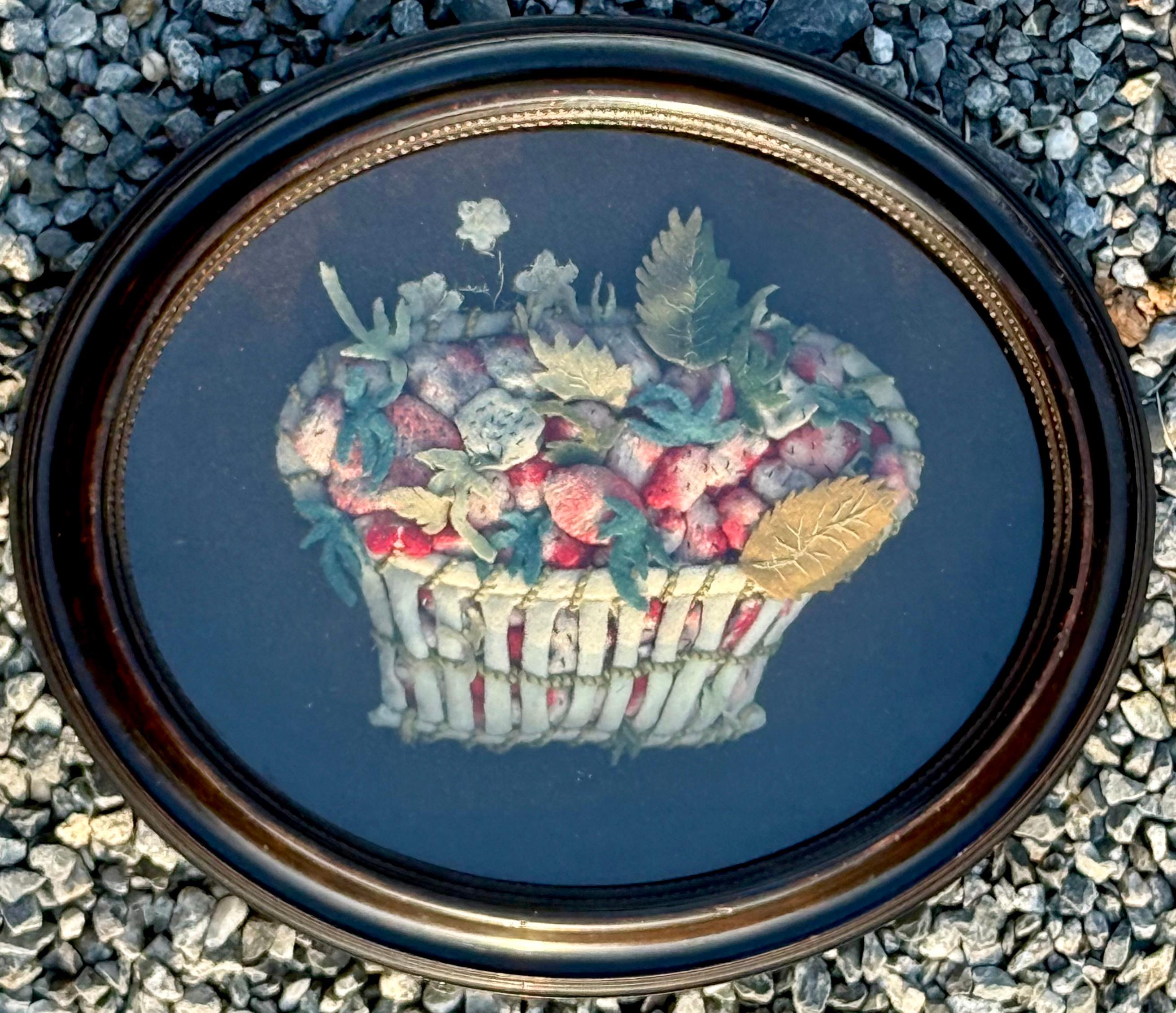 An amazing example of an applique felt work picture of strawberries in a shadowbox frame.  Dating from the 19th century either American or English.  One of the finer examples that I have seen.  Measuring 10