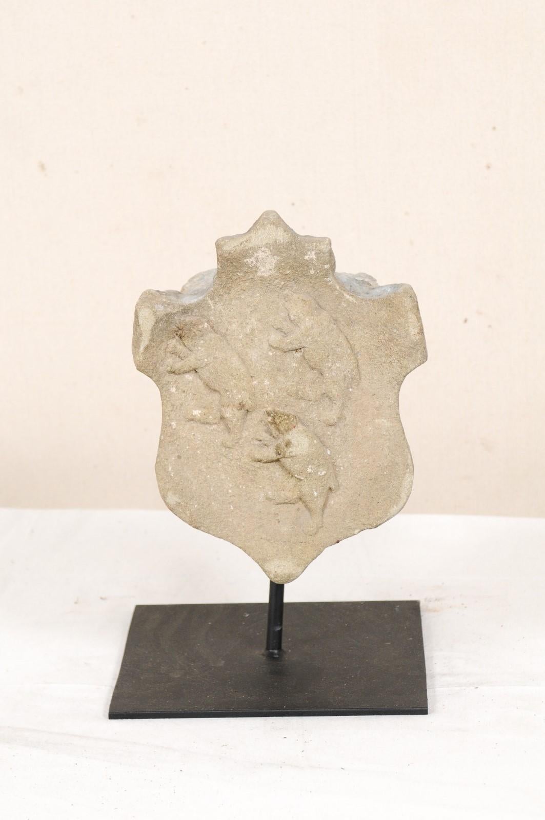 Aragon Spain stone marker from the 19th century, possibly older. This antique architectural fragment from Aragon has been hand carved of stone, featuring a shield-shaped design adorn with three bears carved at its center, and is nicely presented