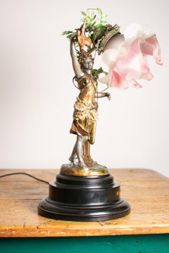 A 19th century Art Nouveau Spelter Figural Woman Table Lamp