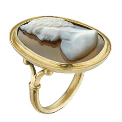A 19th century banded agate cameo and gold ring