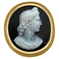 A 19th century banded agate cameo and gold ring