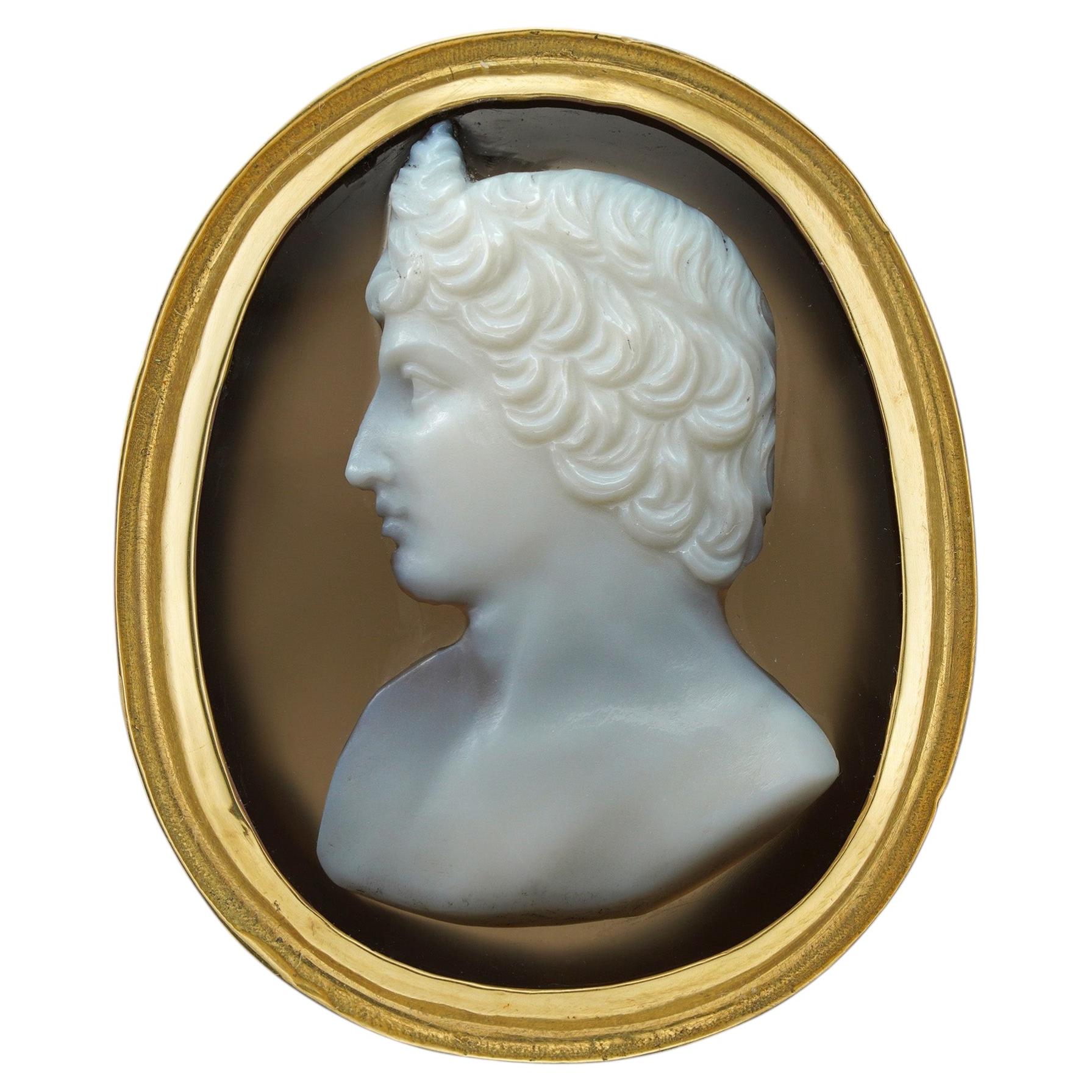 A 19th century banded agate cameo and gold ring